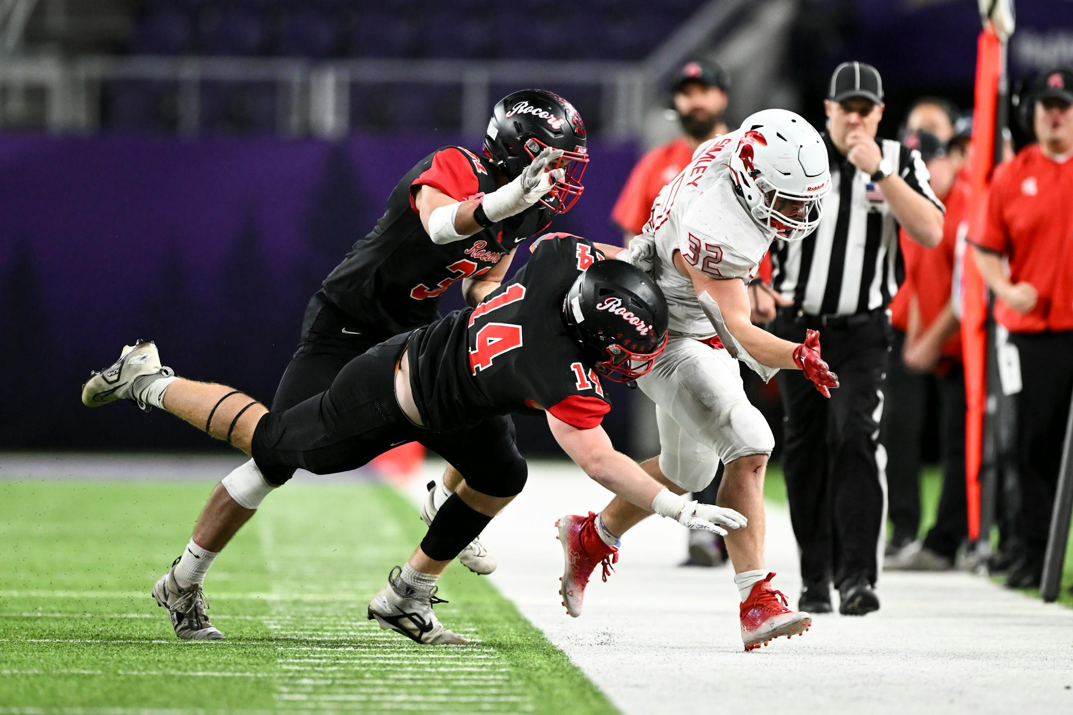 Simley running back Gavin Nelson (32) is run out of bounds by Rocori defenders during the second half.