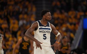 Timberwolves guard Anthony Edwards reacts after hitting a three pointer against the Golden State Warriors in the third quarter in Game 4 of their NBA