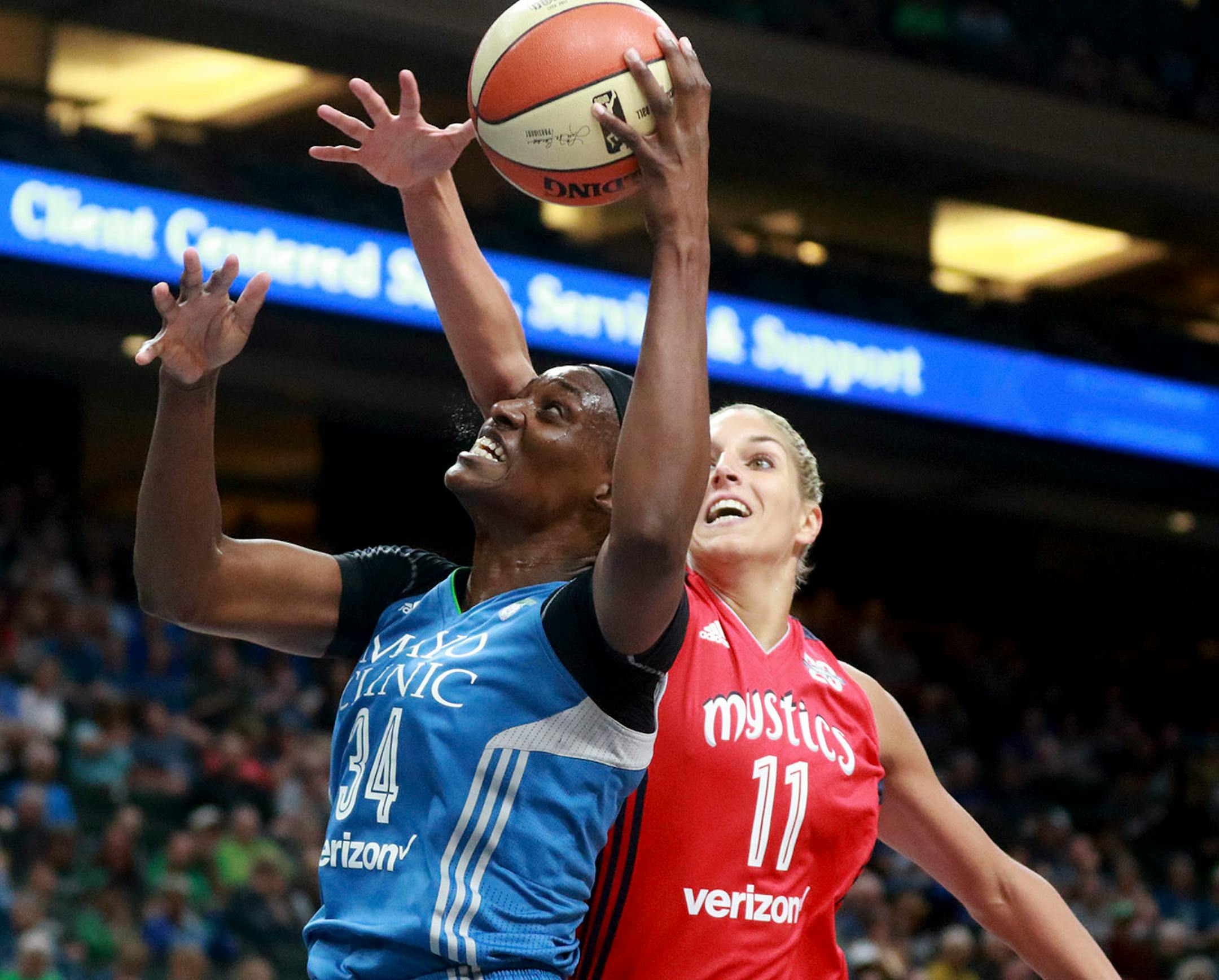 The Minnesota Lynx Krystal Thomas (34) scores over the Washington Mystic's Elena Belle Donne (11) during the first period Friday, June 22, 2017, at the Xcel Energy Center in St. Paul, MN.