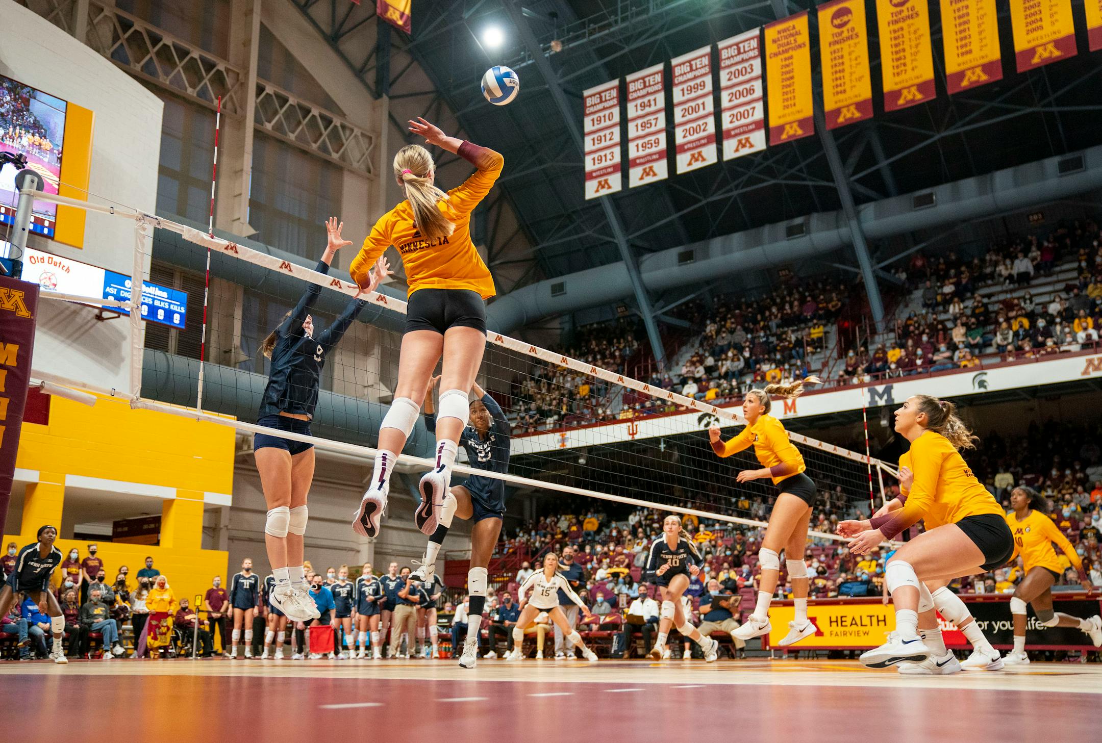Minnesota outside Jenna Wenaas (2) spikes the ball during the first set against Penn State on Friday October, 22, 2021 at Maturi Pavilion in Minneapolis. ]