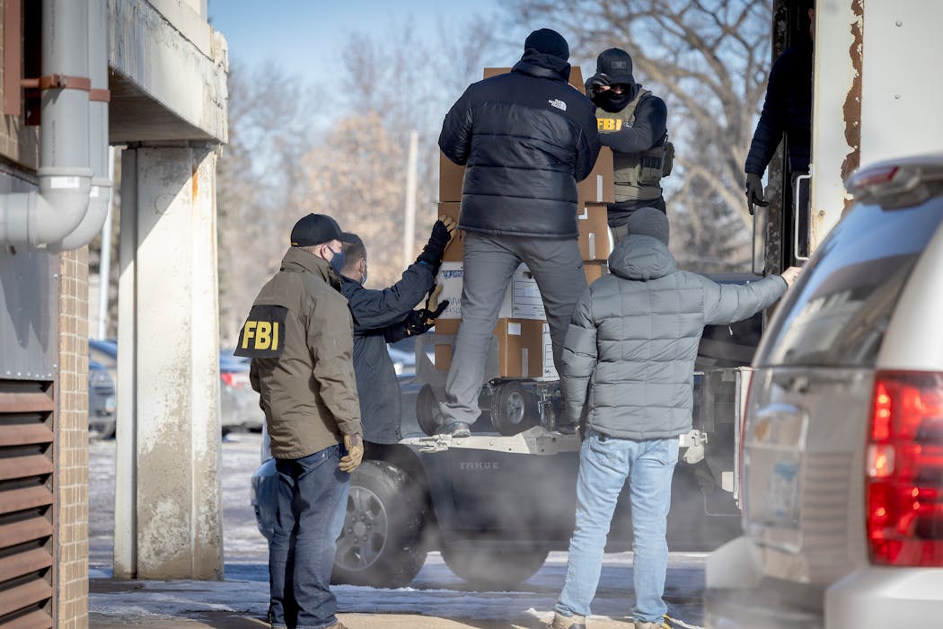 FBI agents raid the Twin Cities nonprofit Feeding our Future in St. Anthony on Jan. 20, 2022.