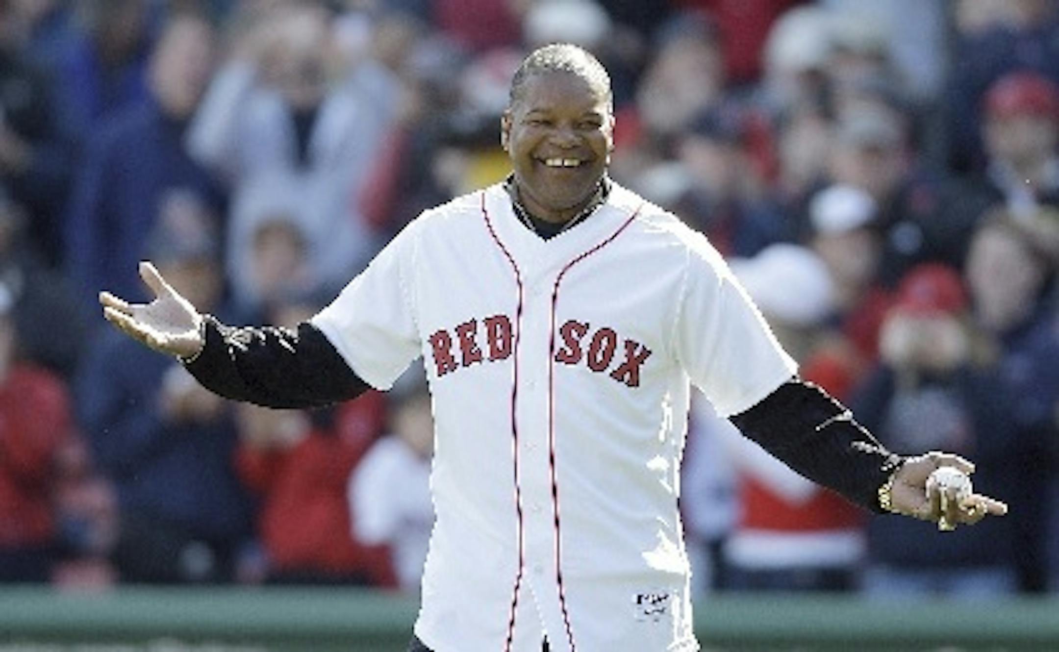 This Oct. 11, 2009 file photo shows former Red Sox outfielder Dave Henderson walking onto the field to throw out the ceremonial first pitch before Game 3 of an American League Division Series between the Red Sox and Angels in Boston. Henderson, who hit one of the most famous home runs in postseason history, died Dec. 27, 2015, after suffering a massive heart attack. He was 57.