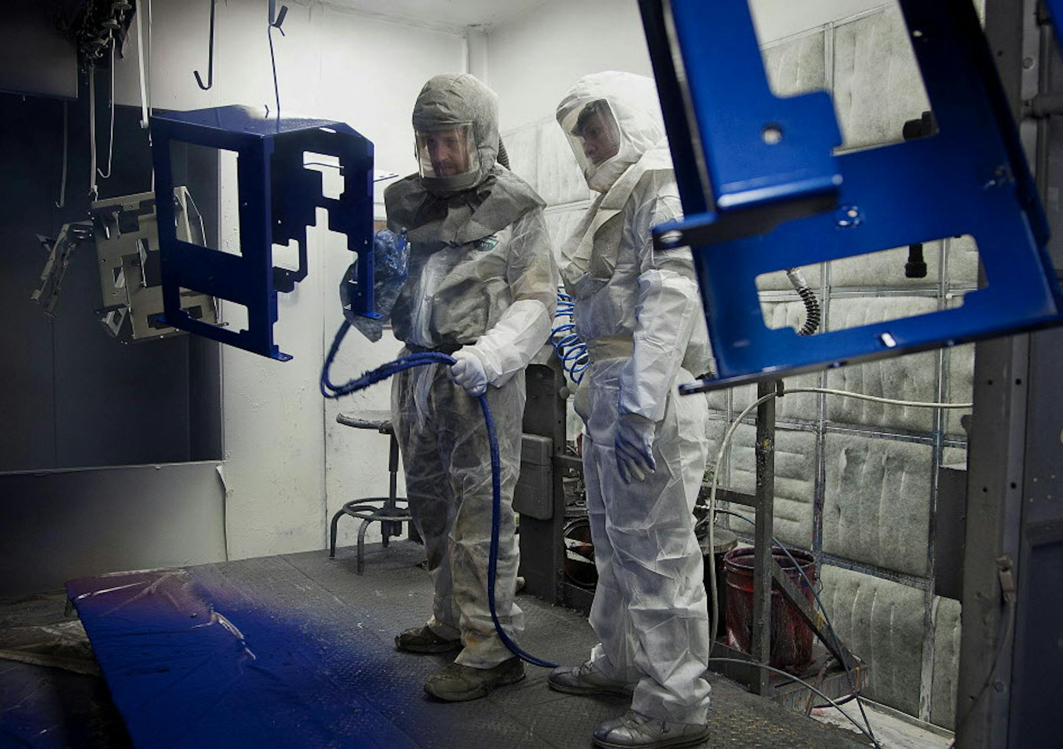 Employee Joe Stelflug, left, and trainee Dwane Whekins paint chassis at the Graco Inc. manufacturing facility in Minneapolis, Minnesota, U.S., on Tuesday, Feb. 5, 2013. The U.S. Federal Reserve is scheduled to release manufacturing production figures on Feb. 15. Photographer: Ariana Lindquist/Bloomberg *** Local Caption *** Joe Stelflug; Dwane Whekins ORG XMIT: 161819514 ORG XMIT: MIN1307011700470833