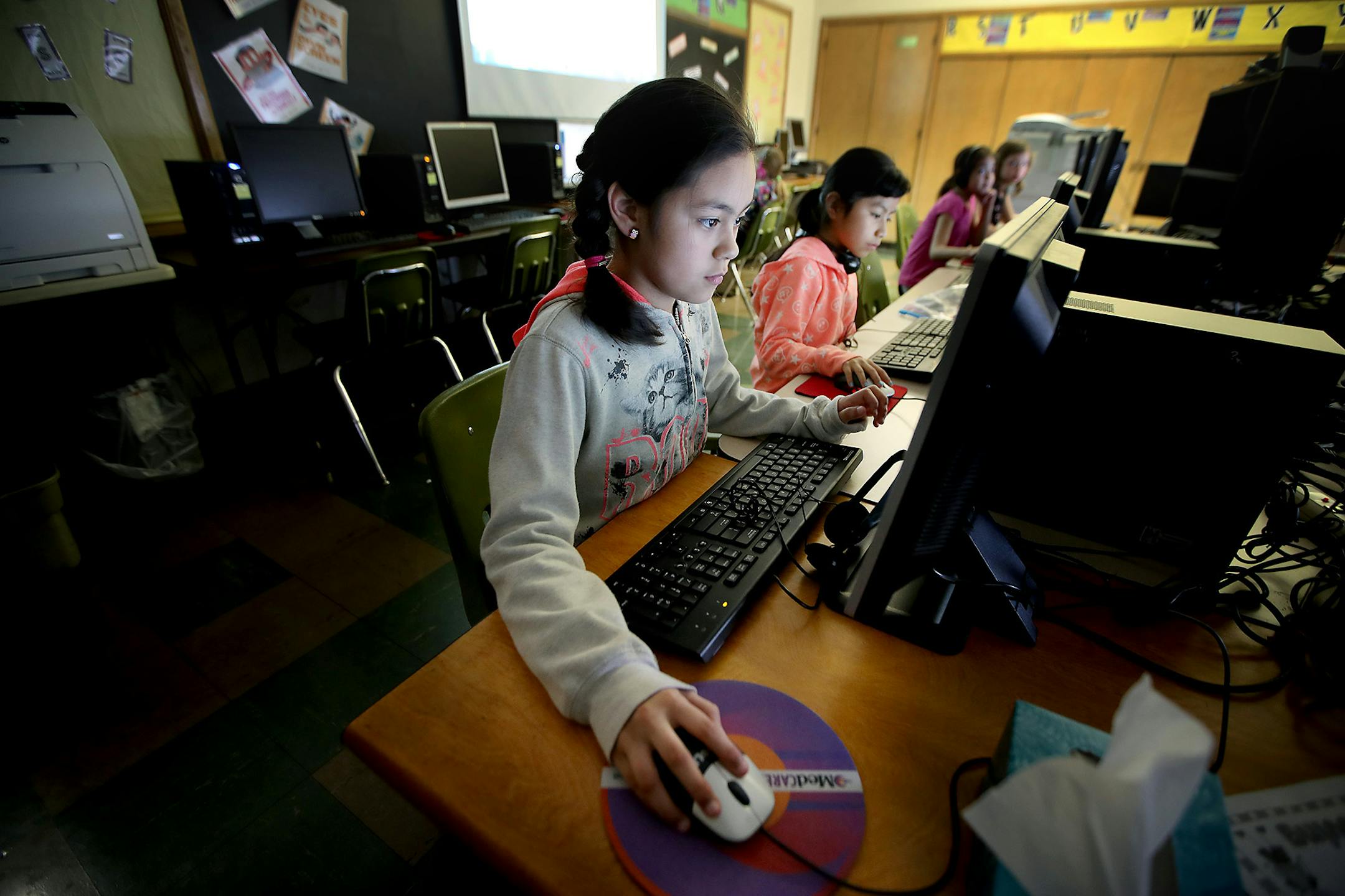 St. Mary's Catholic school students Allisson Lara, cq, left, and Daisy Gabriel, worked on their computer assignments Thursday, February 23, 2017 in Worthington, MN. The two girls supported their parents during the "Day Without an Immigrant," by staying home.