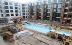 A view of the courtyard with swimming pool and whirlpool in the 25-story Expo apartment tower under construction by Doran Development Wednesday, Sept,