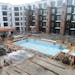 A view of the courtyard with swimming pool and whirlpool in the 25-story Expo apartment tower under construction by Doran Development Wednesday, Sept,