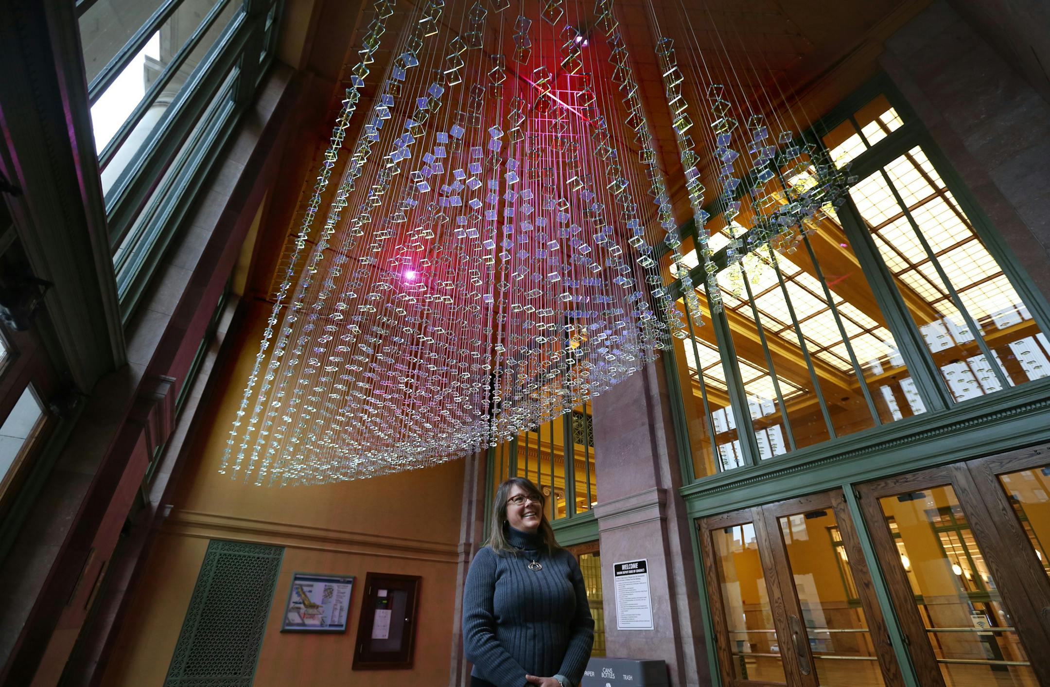 Deborah Carter McCoy looked over the "Twin Waves" glass sculpture by artist Ray King at the Union Depot Wednesday October 30, 2013 in St Paul, MN.Ramsey County Board pledged $1.25 million of the Union Depot's $243 million renovation project to be directed to public art in the refurbished train station, it wasn't kidding. In the last few months, new art works have been installed at the depot, reflecting its location deep in the Lowertown artists' colony. ] JERRY HOLT ‚Ä¢ jerry.ho