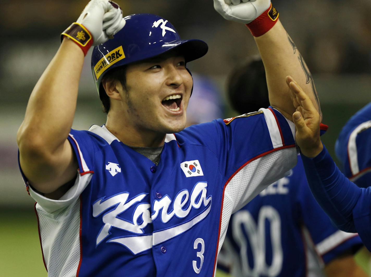 FILE - In this Saturday, Nov. 21, 2015 file photo, South Korea's Park Byung-ho celebrates at the bench after hitting a three-run home run against Team USA in the fourth inning of their final game at the Premier12 world baseball tournament at Tokyo Dome in Tokyo. South Korean first baseman Byung Ho Park has agreed to a $12 million, four-year contract with the Minnesota Twins, Tuesday, Dec. 1, 2015. (AP Photo/Toru Takahashi, File)