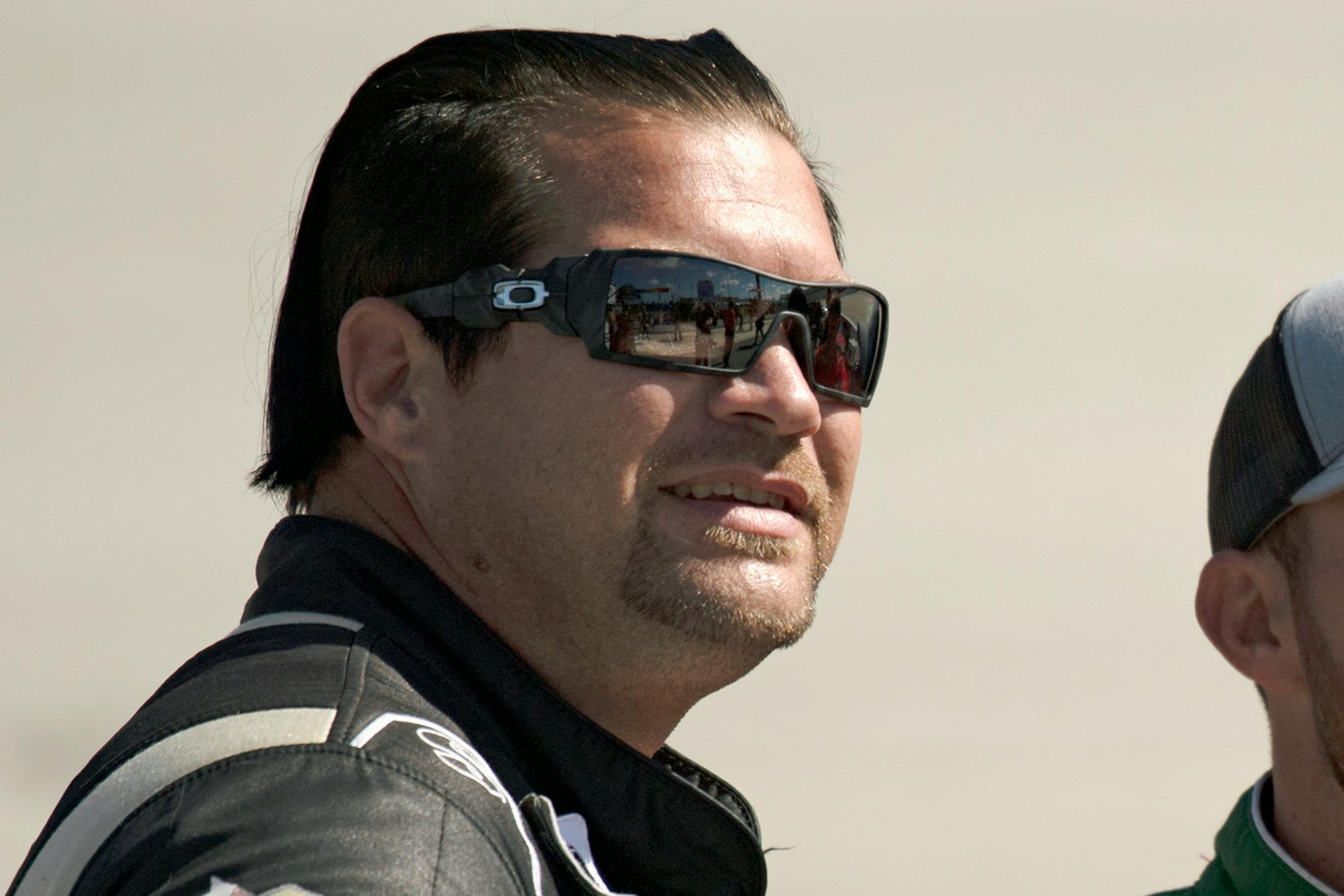 In this Oct. 5, 2019, file photo, driver B.J. McLeod waits to get into his car before qualifying for the NASCAR Xfinity Series race in Dover, Del.
