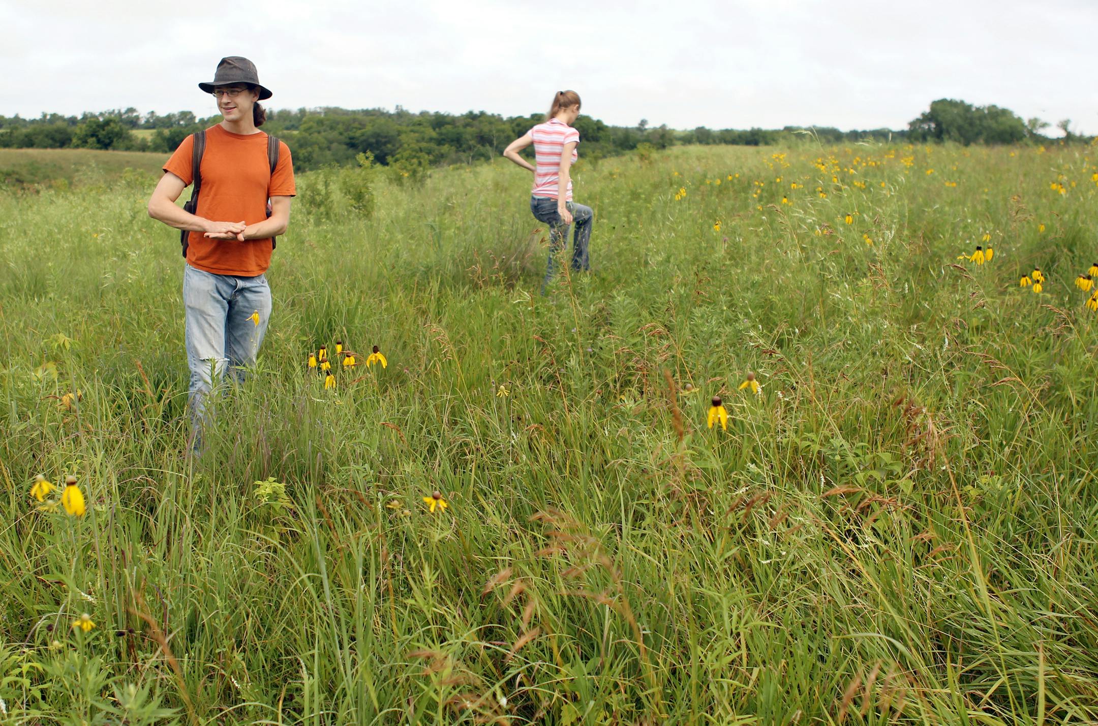 Mike Lynch and his wife, Kassa Lynch, explore the Lost Valley Prairie, SNA (scientific and natural area) in Cottage Grove, Minn., on Sunday, July 21, 2013. ] (ANNA REED/STAR TRIBUNE) anna.reed@startribune.com (cq)