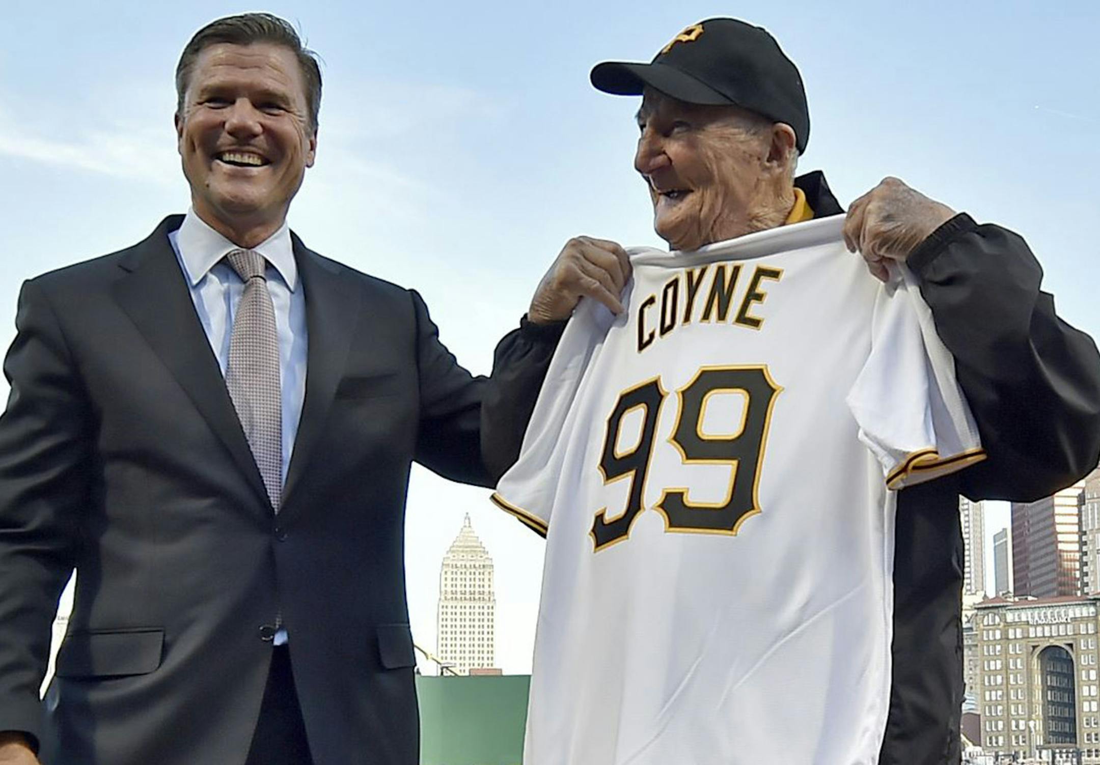 Pirates president Frank Coonelly presents usher Phil Coyne with a Pirates jersey with his age as the number Wednesday at PNC Park. Coyne, a longtime usher, has a bevy of Pirates memories, including seeing Bill Mazeroski's World Series-winning home run in 1960. (Matt Freed/Pittsburgh Post-Gazette/TNS) ORG XMIT: 1201363