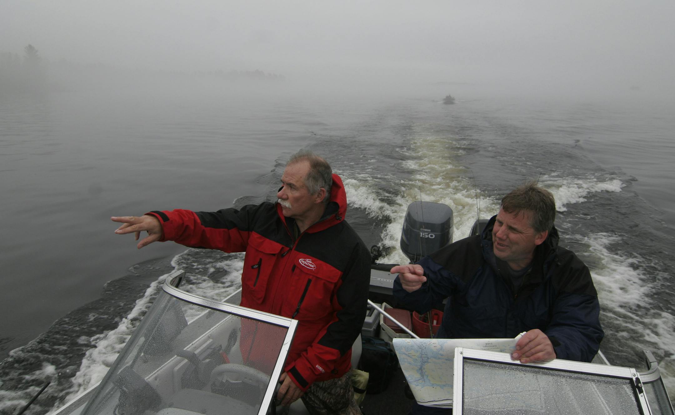 Jack Rendulich of Duluth, left, and Bob Homstad of Minneapolis tried to navigate in thick fog recently on Namakan Lake in Voyageurs National Park.