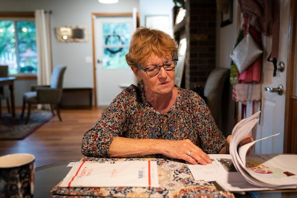 Monika Dipert looked through paperwork she has been collecting about the contaminated water in her home in Andover, Minn., on Thursday, September 23, 