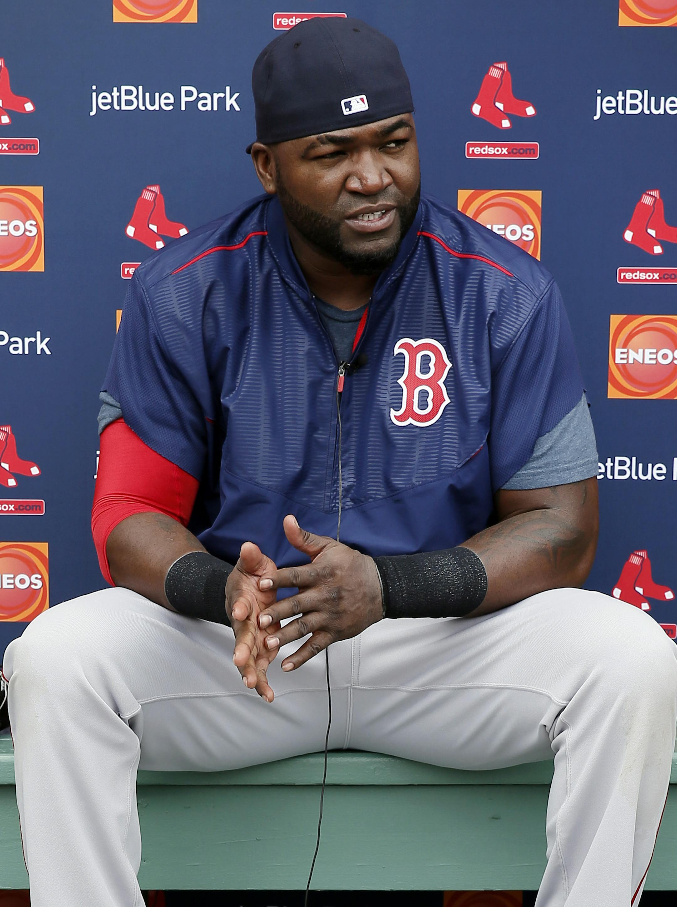 Boston Red Sox's David Ortiz sits with his bat by his feet as he takes questions during a news conference after a morning workout at baseball spring training in Fort Myers Fla., Wednesday Feb. 25, 2015. (AP Photo/Tony Gutierrez)