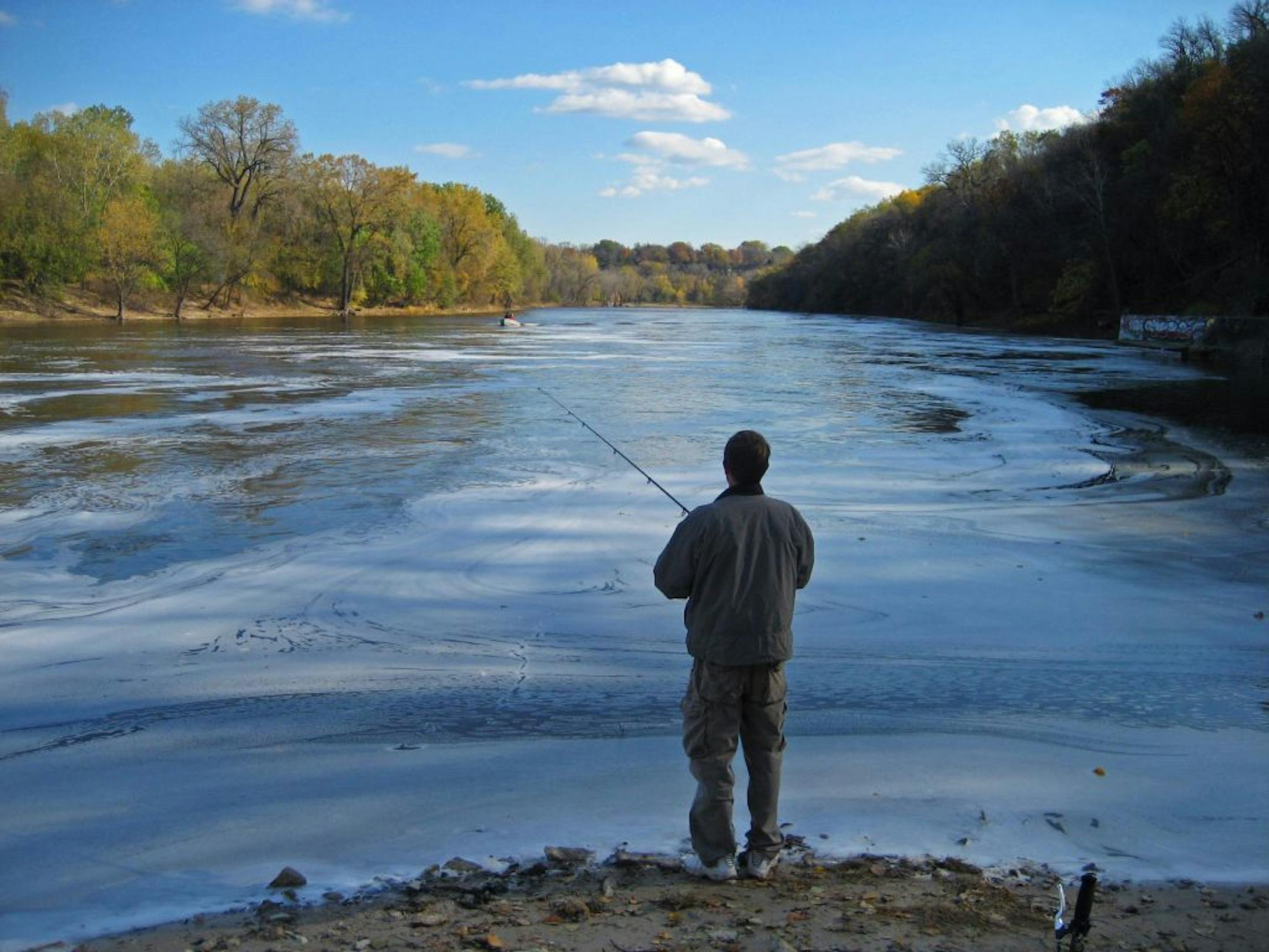 PETER KOELEMAN � pkoeleman@startribune.com - Minneapolis, October 27, 2007 - Anthony (would not give his last name) fished off the banks of the Mississippi where the Minnehaha Creek flows into the river. He said he the fishing was good and that he caught two walleyes but threw both of them back.
