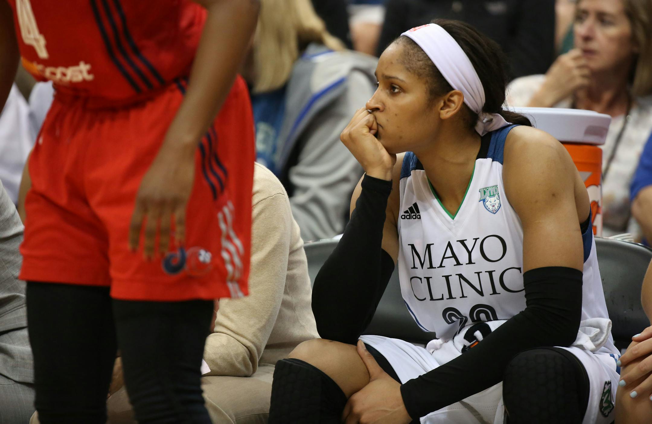 Maya Moore sat of the bench near the end of a home loss to Washington on Wednesday night.