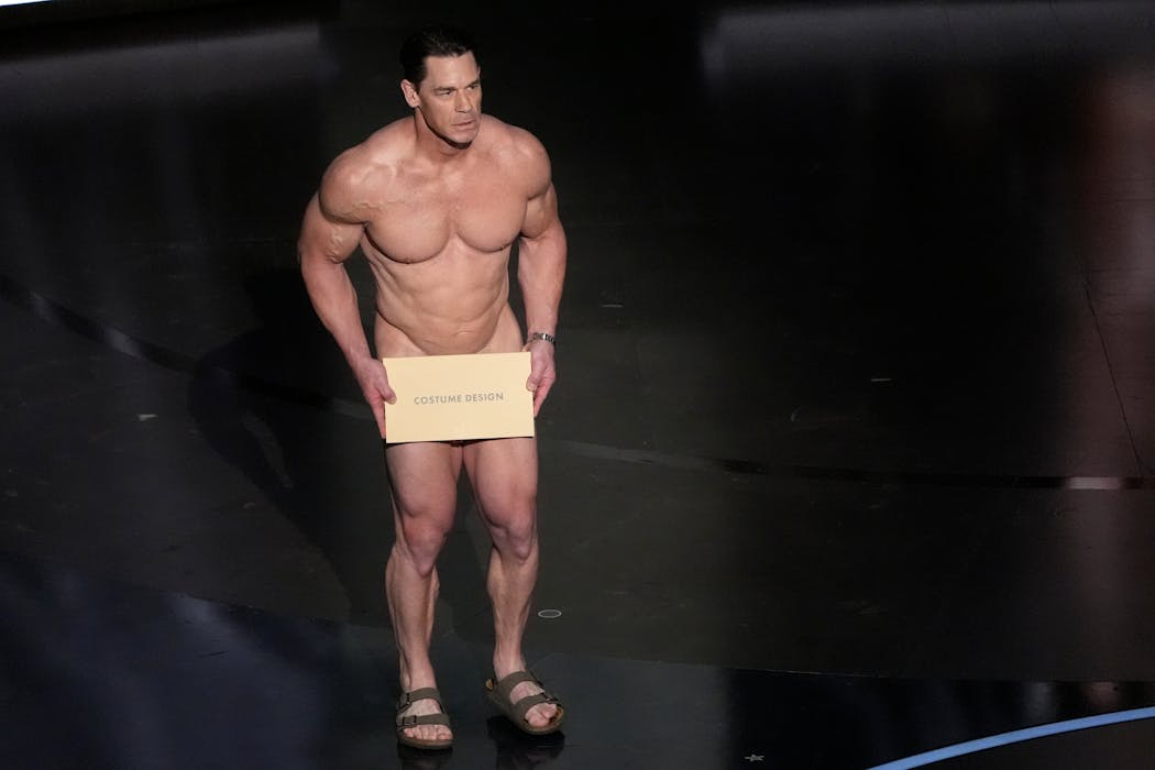 John Cena, who handed out the award for best costume design Sunday night, appears onstage naked save for an envelope. When host Jimmy Kimmel asked him to do a streaker bit, Cena hesitated. “The male body is not supposed to be funny,” Cena said. “Mine is,” Kimmel responded.