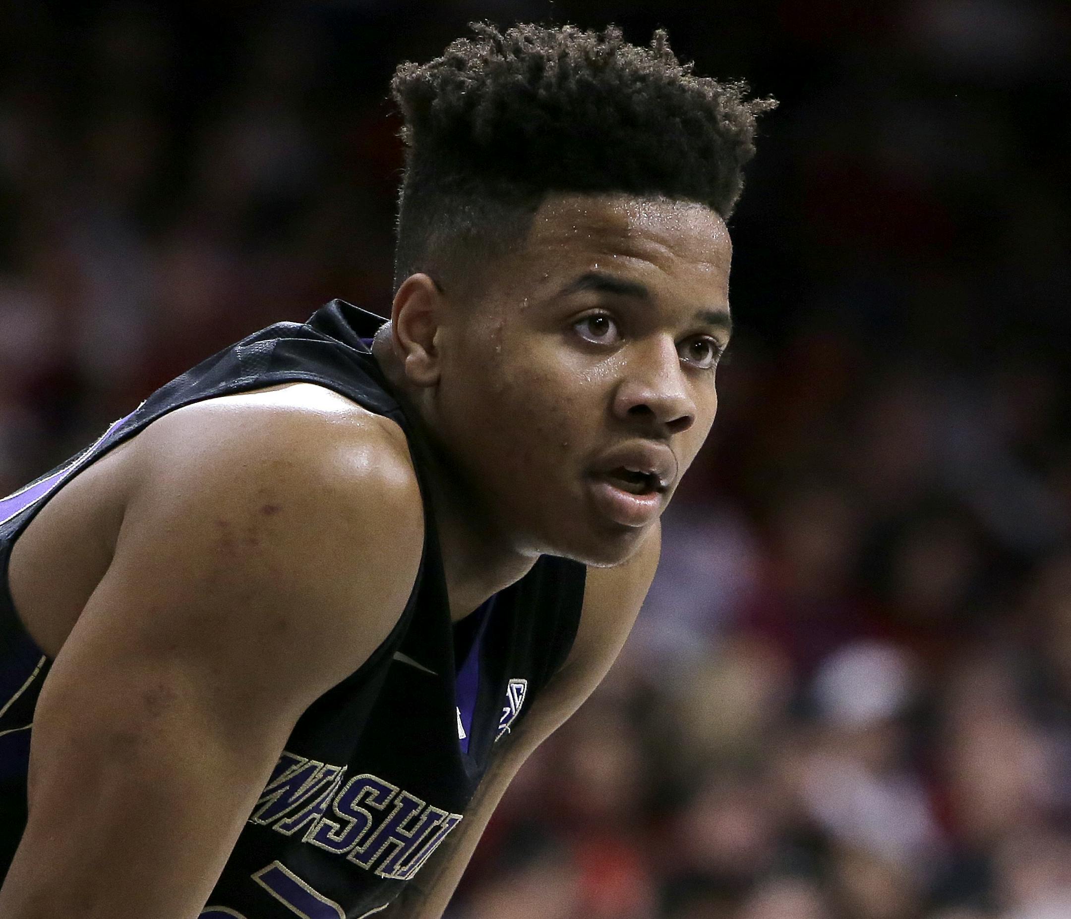 FILE - In this Jan. 29, 2017, file photo, Washington guard Markelle Fultz (20) is shown during the second half of an NCAA college basketball game against Arizona, in Tucson, Ariz. Fultz is the likely No. 1 pick in the NBA Draft on Thursday night, June 22. (AP Photo/Rick Scuteri, File)