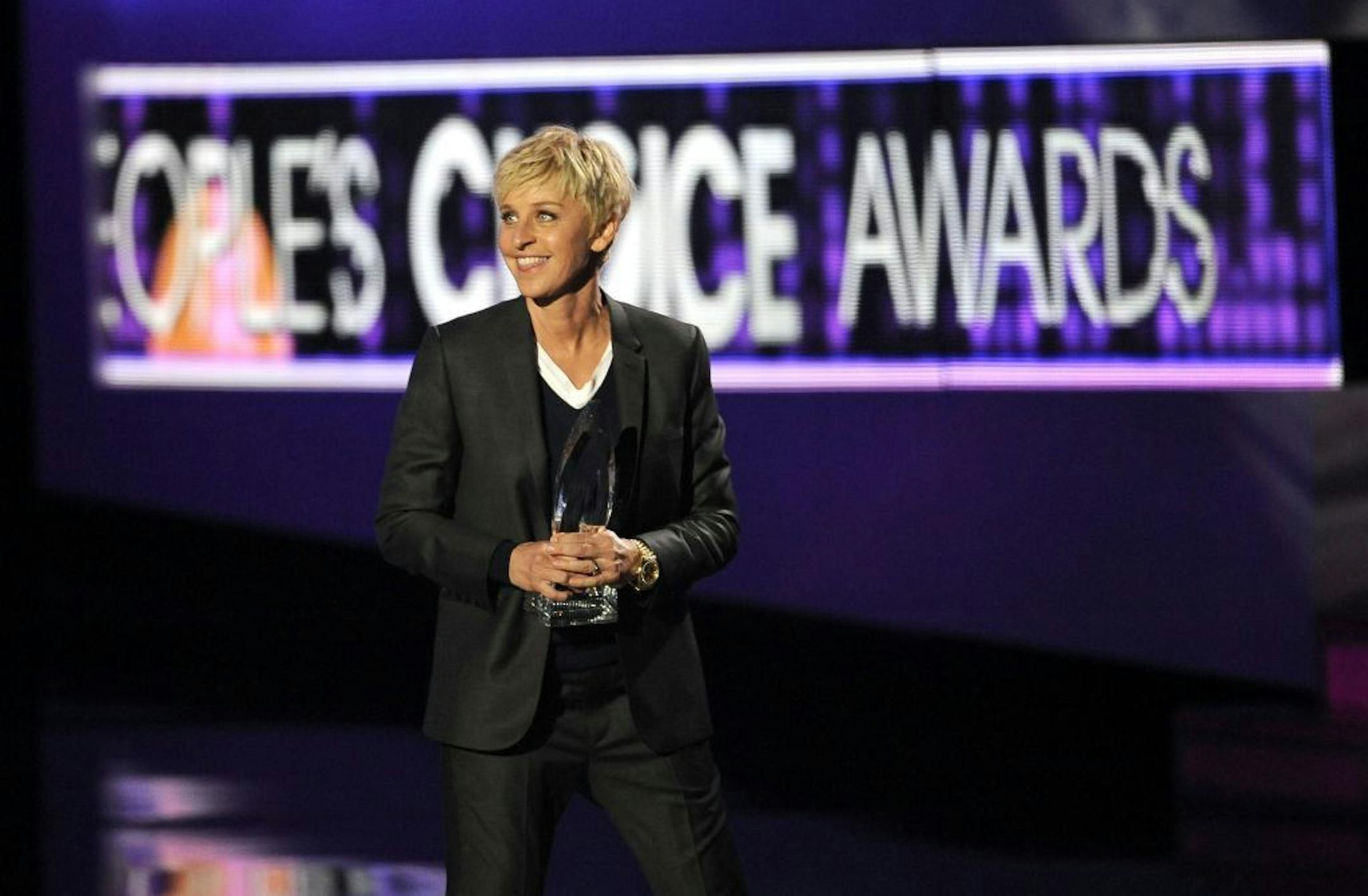 FILE - In this Jan. 11, 2012 file photo, Ellen DeGeneres accepts the award for favorite daytime TV host for "The Ellen Degeneres Show" during the People's Choice Awards, in Los Angeles. DeGeneres, who worked at a Penney store in Louisiana as a teen in the 1970s, is swapping ideas, plans to make store appearances and help educate shoppers about its bold new moves in its new ad campaigns that will break this spring.