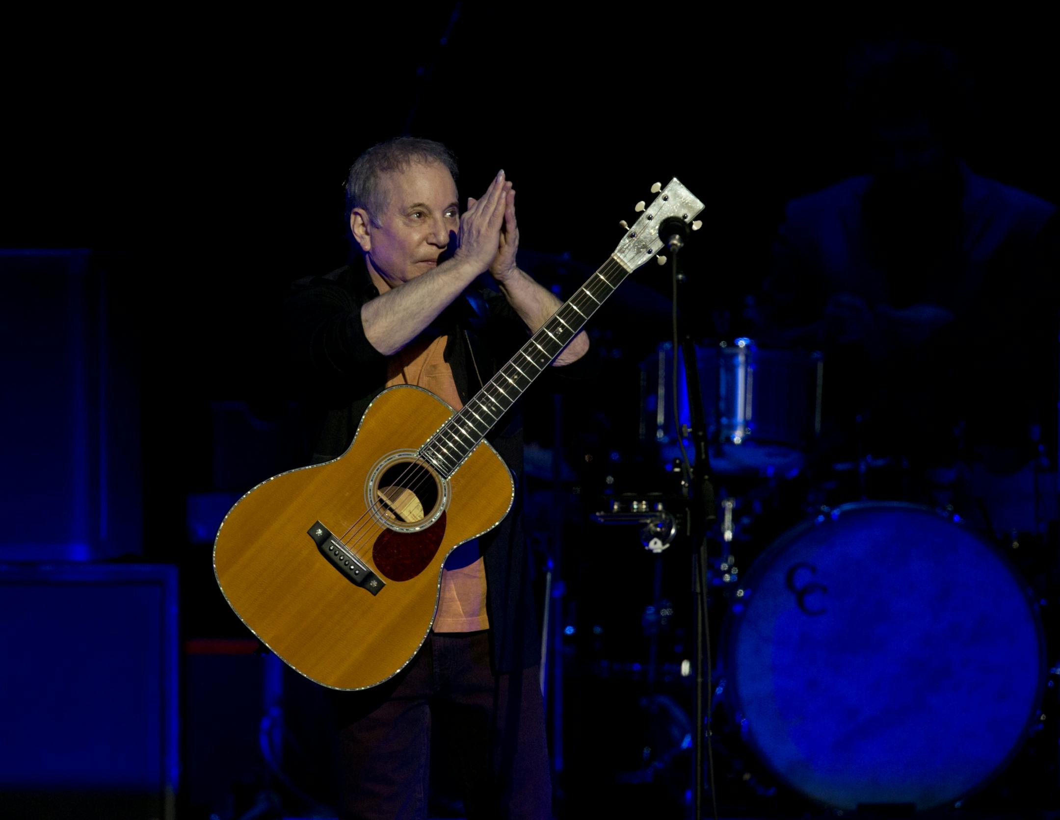 Longtime New York neighbors Sting and Paul Simon decided to hit the road and tour together. The Paul Simon & Sting: On Stage Together tour stopped at Xcel Energy Center in St. Paul Sunday night, February 23, 2014. Paul Simon acknowledged the applause of the audience as he took the stage to begin the concert Sunday night at Xcel Energy Center.