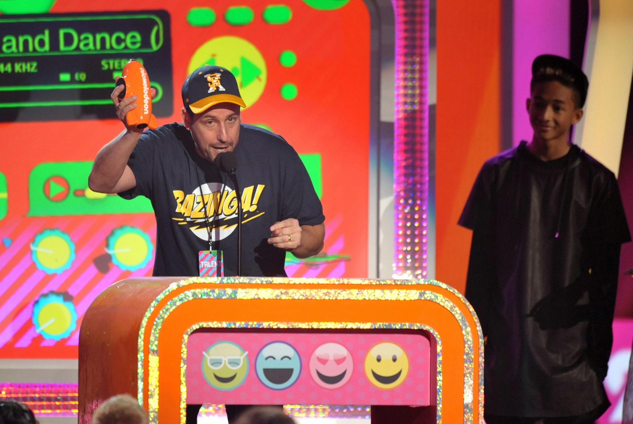 Adam Sandler accepts the award for favorite voice in an animated movie for ìHotel Transylvaniaî at the 26th annual Nickelodeon's Kids' Choice Awards on Saturday, March 23, 2013, in Los Angeles. (Photo by John Shearer/Invision/AP)