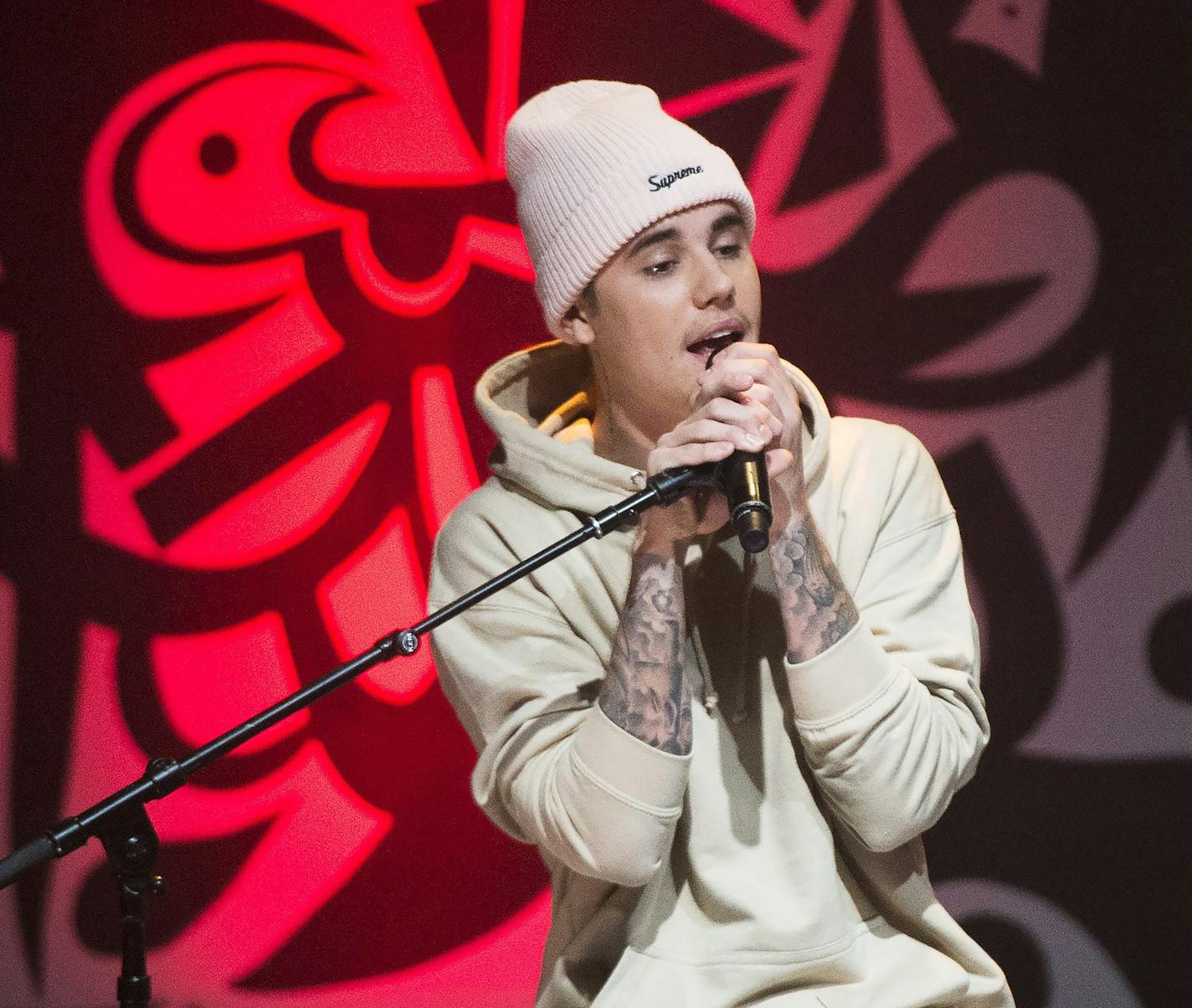 Canadian singer Justin Bieber performs live during a small concert for charity in Toronto on Monday, Dec. 7, 2015. (Nathan Denette/The Canadian Press via AP)