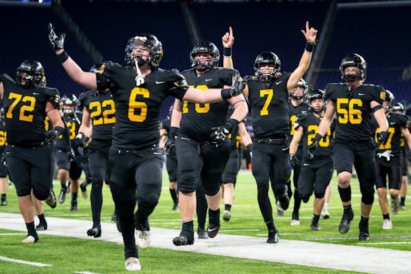 Hutchinson High School players celebrate their win after the 4a game against Rocori High School at U.S. Bank Stadium for the Prep Bowl XLI in Minneapo