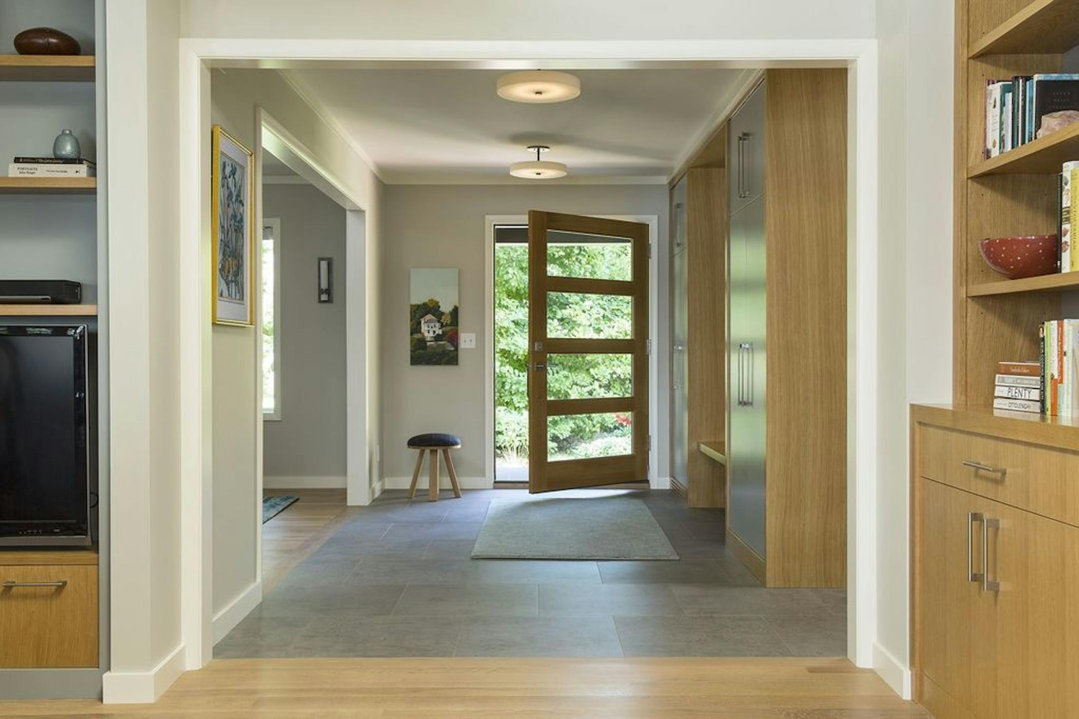 The new entry has a wider doorway and a custom door that lets in more light.
