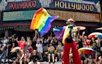 A dancer on stilts marches along Hollywood Blvd. during the Los Angeles Pride parade June 12.