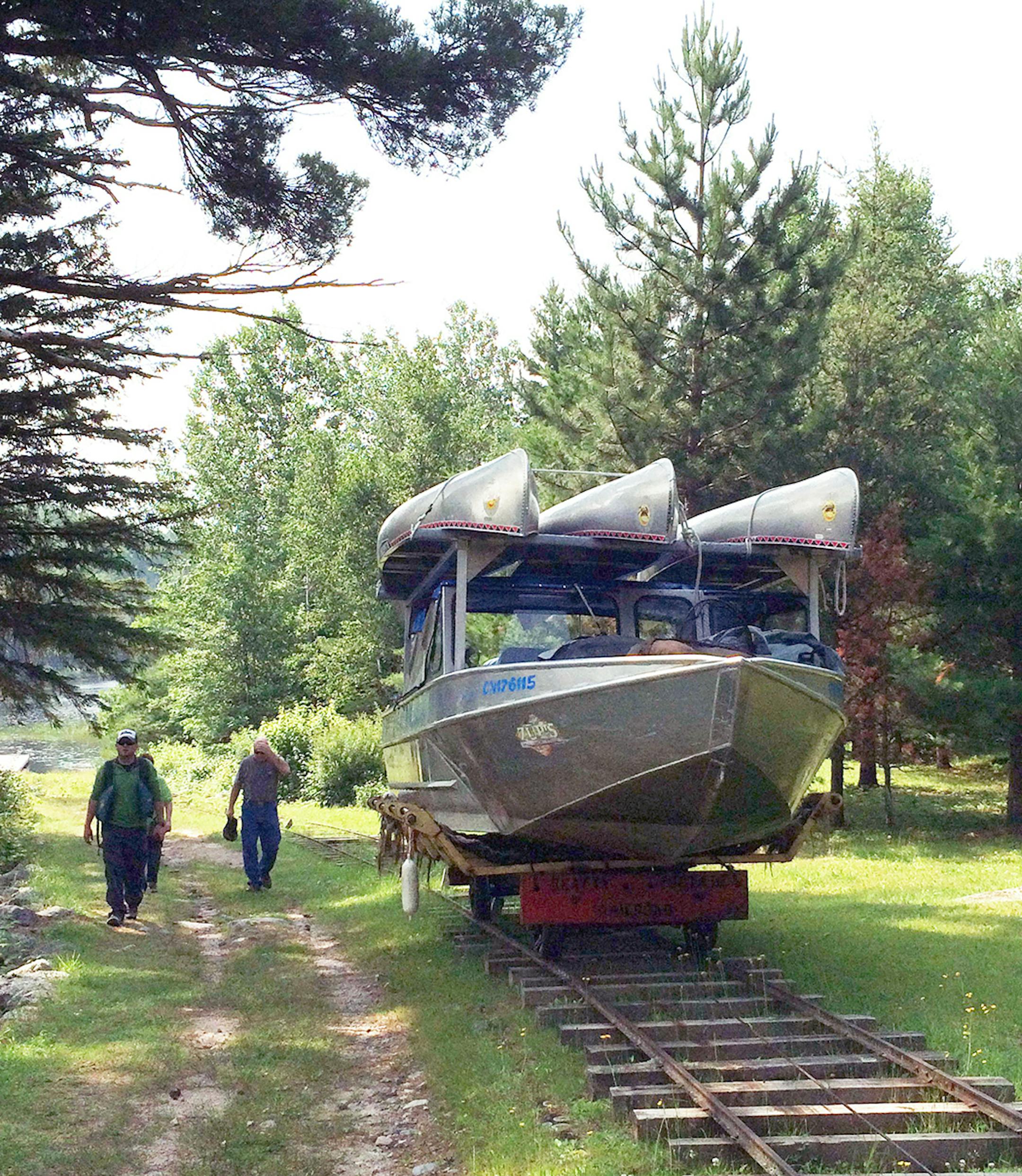 Railroad tracks are used on two mechanical rail portages between Crane Lake and Lac La Croix. Boats are put on a cart and pulled across the portage with an engine-powered cable system.