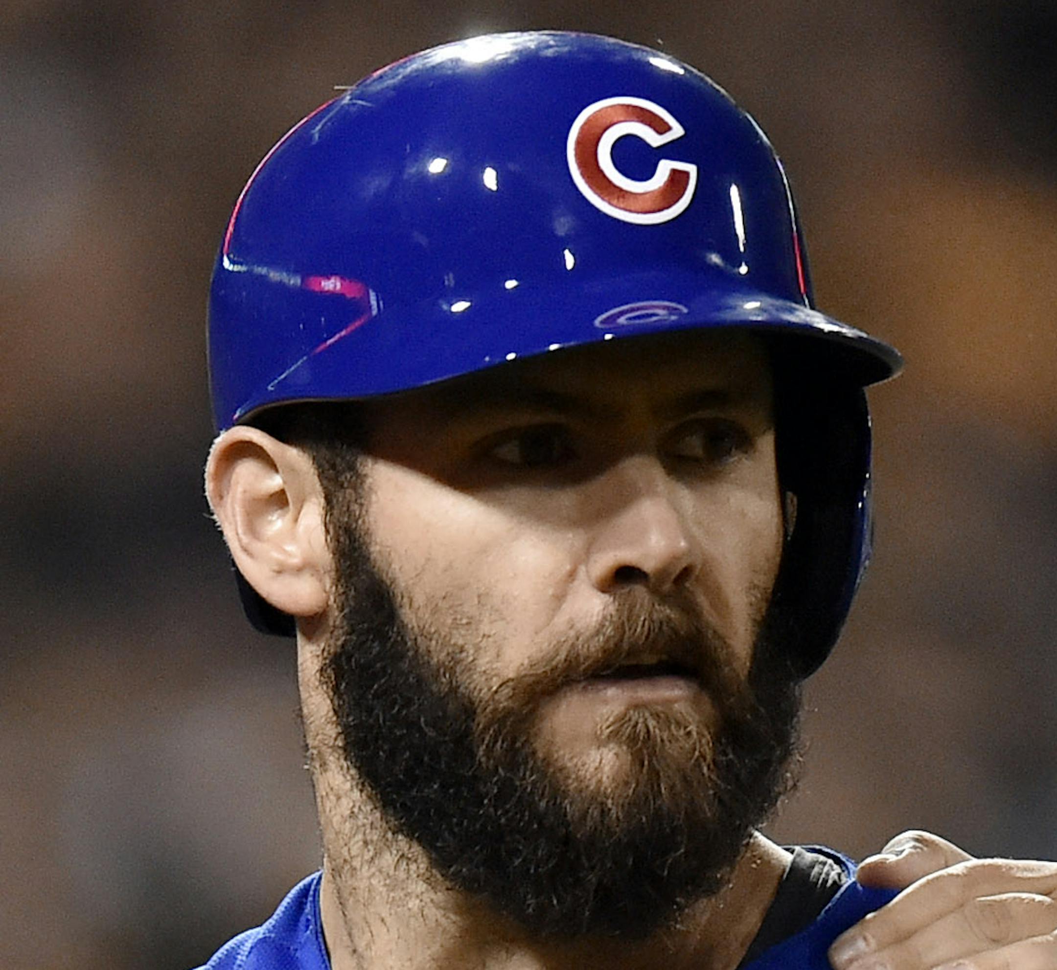 Chicago Cubs starting pitcher Jake Arrieta, center, is pulled away from a scrum by first base umpire Hunter Wendelstedt after he was hit by a pitch by Pittsburgh Pirates relief pitcher Tony Watson in the seventh inning of the National League wild card baseball game, Wednesday, Oct. 7, 2015, in Pittsburgh.(AP Photo/Don Wright)
