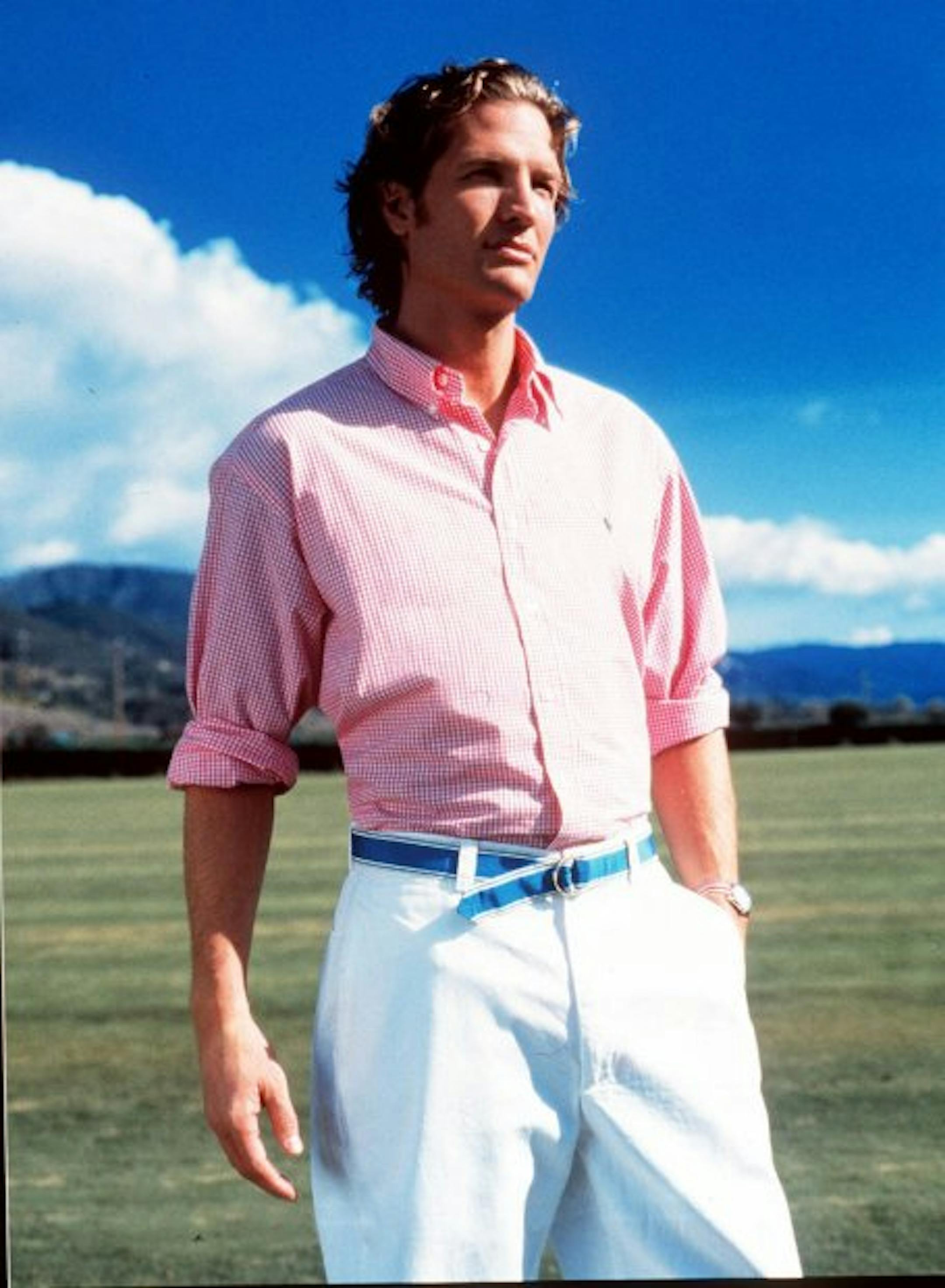 FOR USE WITH AP WEEKLY FEATURES -- Bright shirts, madras prints and Bermuda shorts _ create the season's favored preppy styles for both women and men. It might be easier for men to ease into a new look by simpling changing the color of their button-down shirts, maybe switching to a Polo Ralph Lauren pink/white gingham oxford, suggests Carolyn Moss, fashion director for Macy's East. (AP Photo/Macy's)