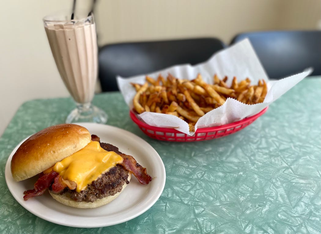After four years and a little reconstruction and refresh, the Convention Grill in Edina is serving burgers, fries and malts once again. The 