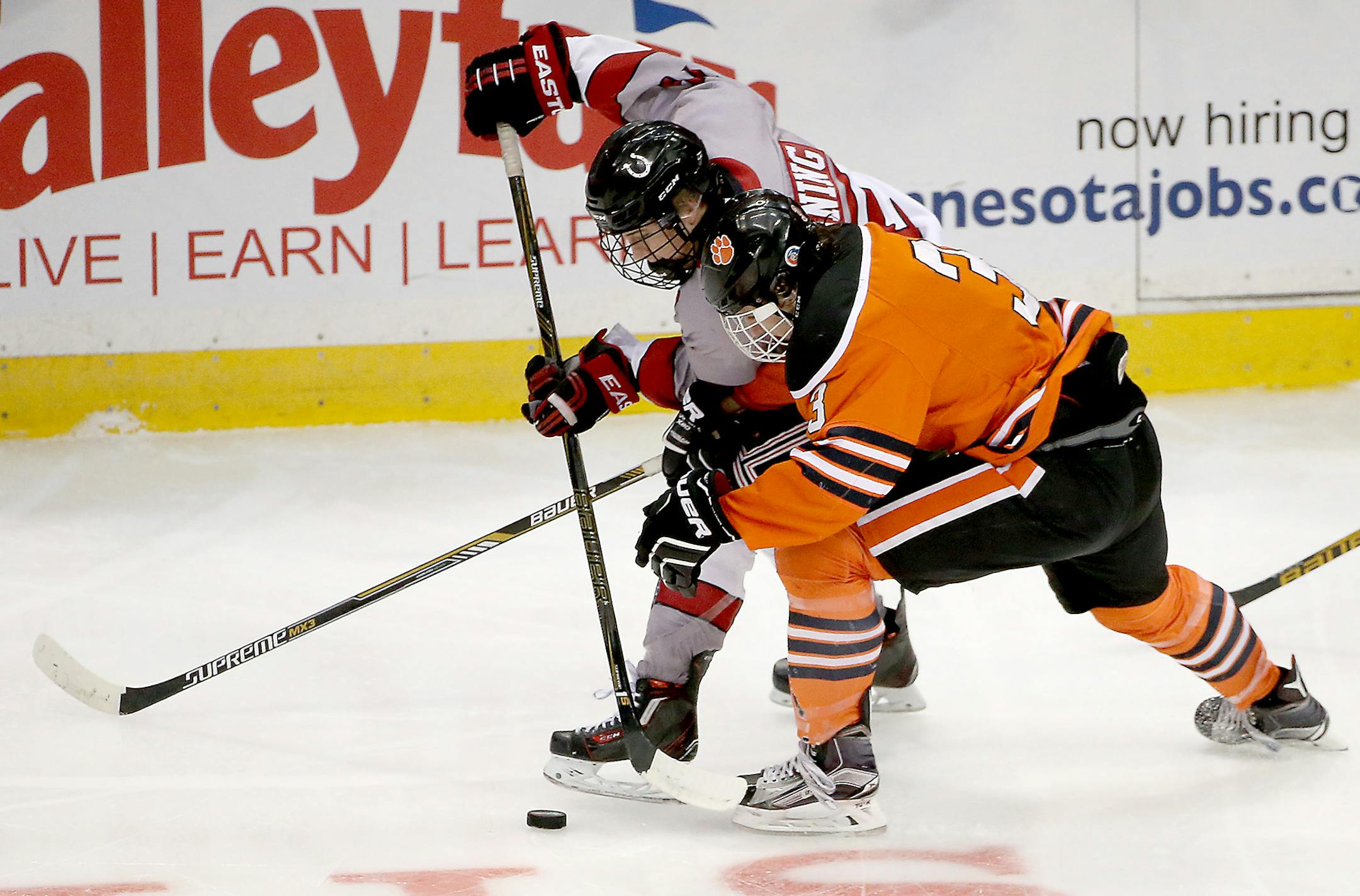 Stillwaters' Luke Manning, left, and Farmington's Grady Hauswirth battled for the puck during the first period of the Class 2A boys' hockey quarterfinals, Thursday, March 3, 2016 at Xcel Energy Center in St. Paul, MN. ] (ELIZABETH FLORES/STAR TRIBUNE) ELIZABETH FLORES &#x2022; eflores@startribune.com