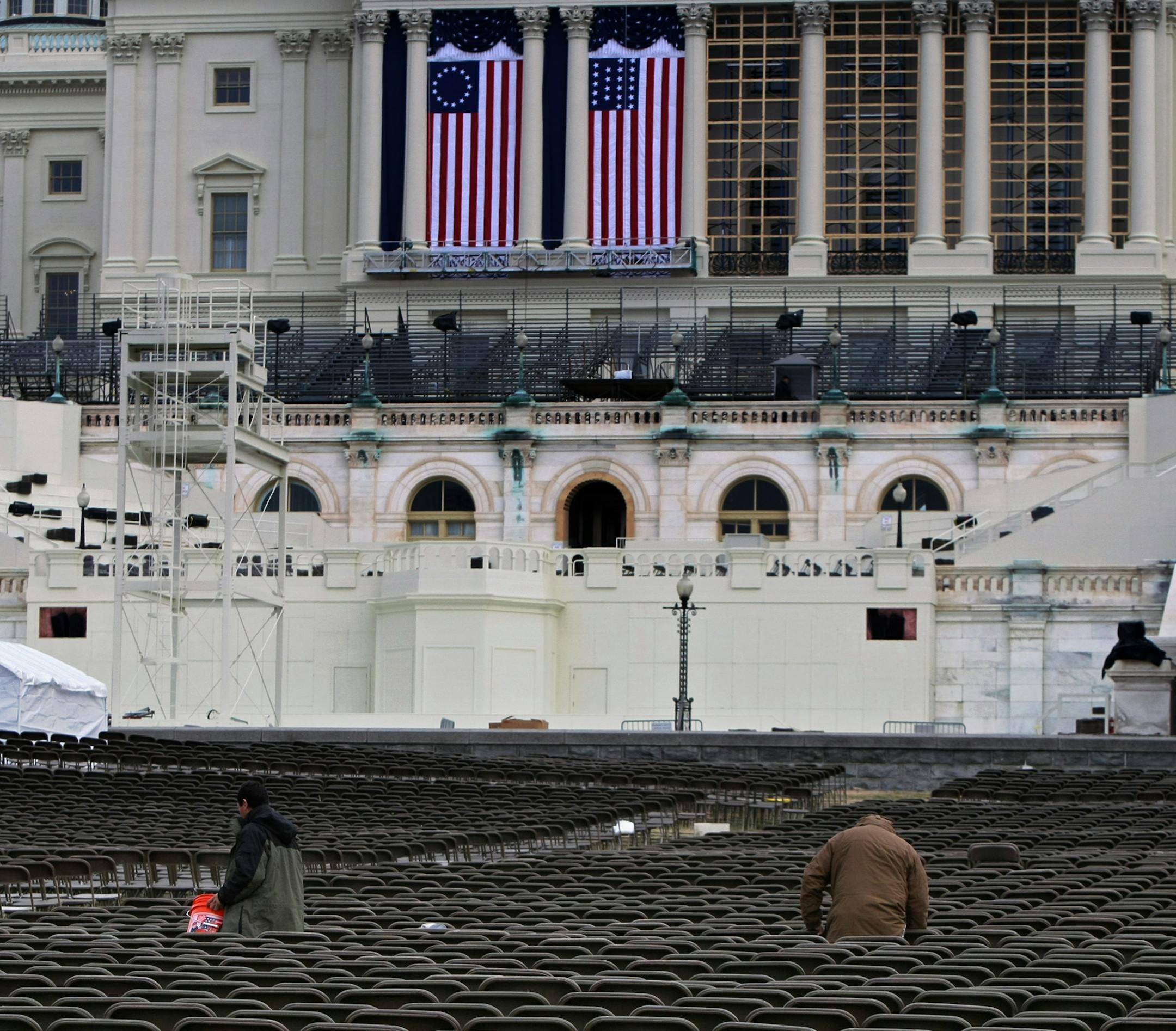 Workers work with chairs at the west front of the Capitol in Washington Saturday, Jan. 10, 2009, as preparations continue around Washington for the inauguration of President-elect Barack Obama on Jan. 20.