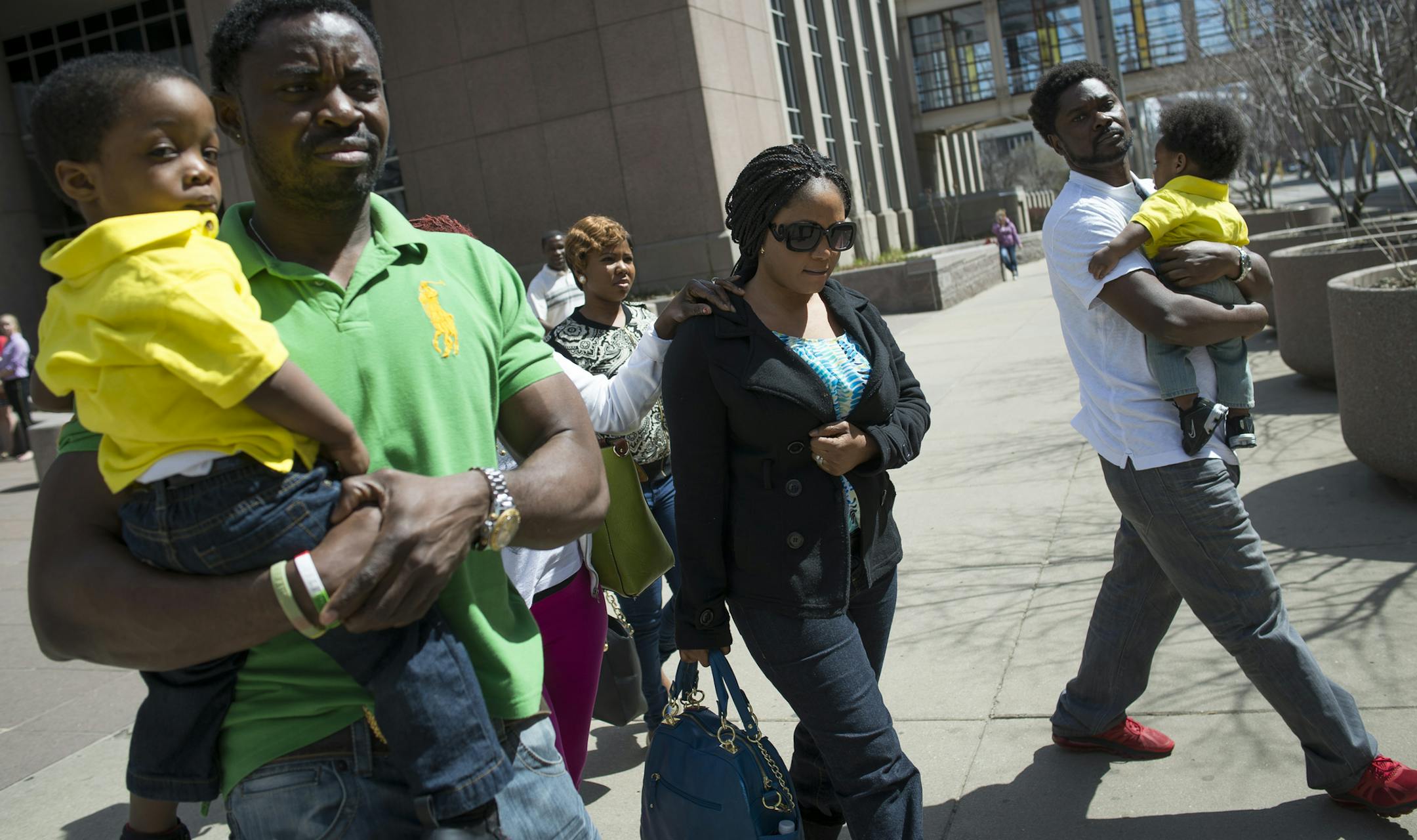 Members of the Collins family, including Yamah Collins, center, leave the Hennepin County jail after Pierre Collin's first court appearance on Wednesday afternoon in the murder trial of his 10-year old son, Barway. ] (Aaron Lavinsky | StarTribune) aaron.lavinsky@startribune.com The Collins family leaves the first court appearance of Pierre Collin's murder trial on Wednesday, April 15, 2015 in Minneapolis.