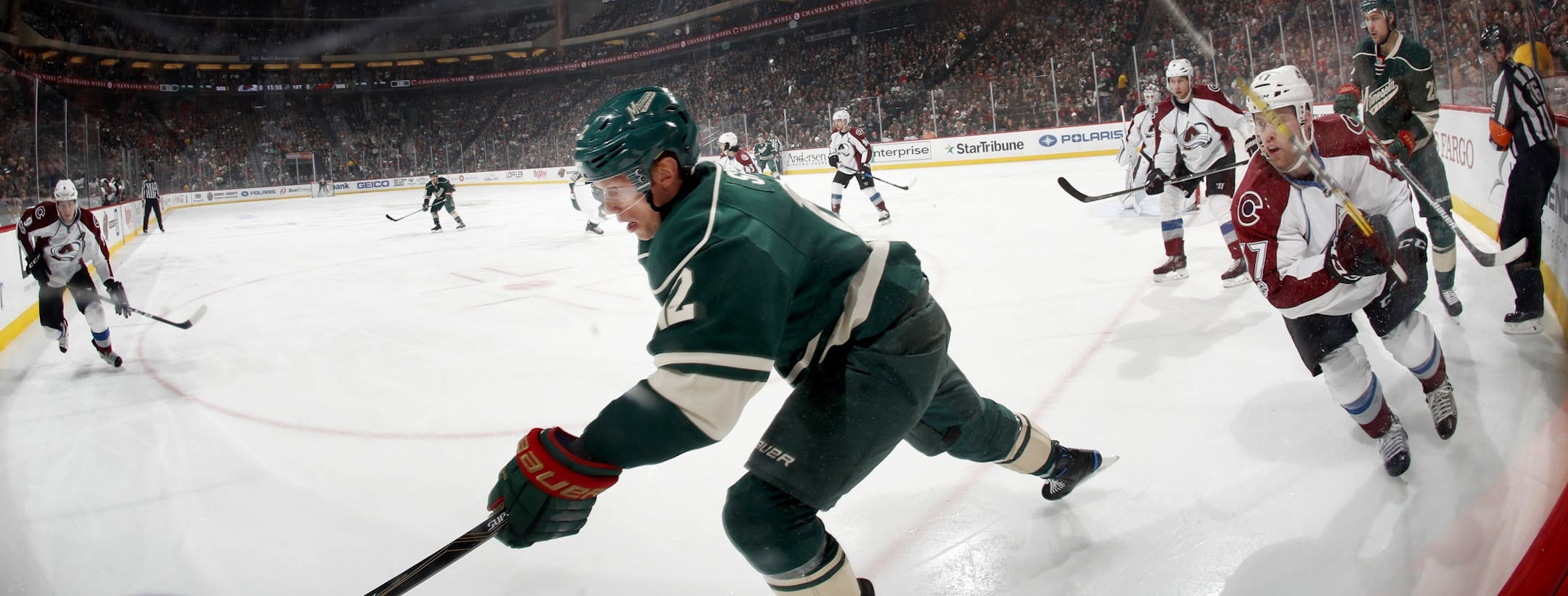 Eric Staal (12) chased the puck into the corner in the first period.