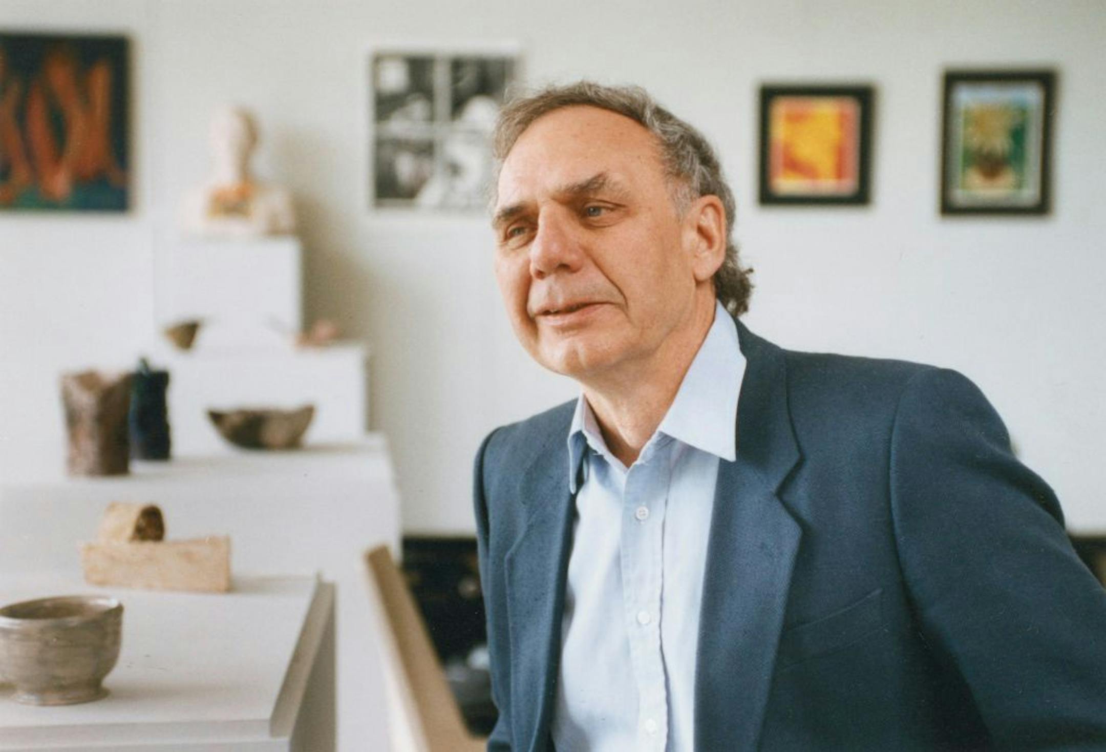 Wally Kennedy, surrounded by student art work at the Arts High School in Golden Valley.