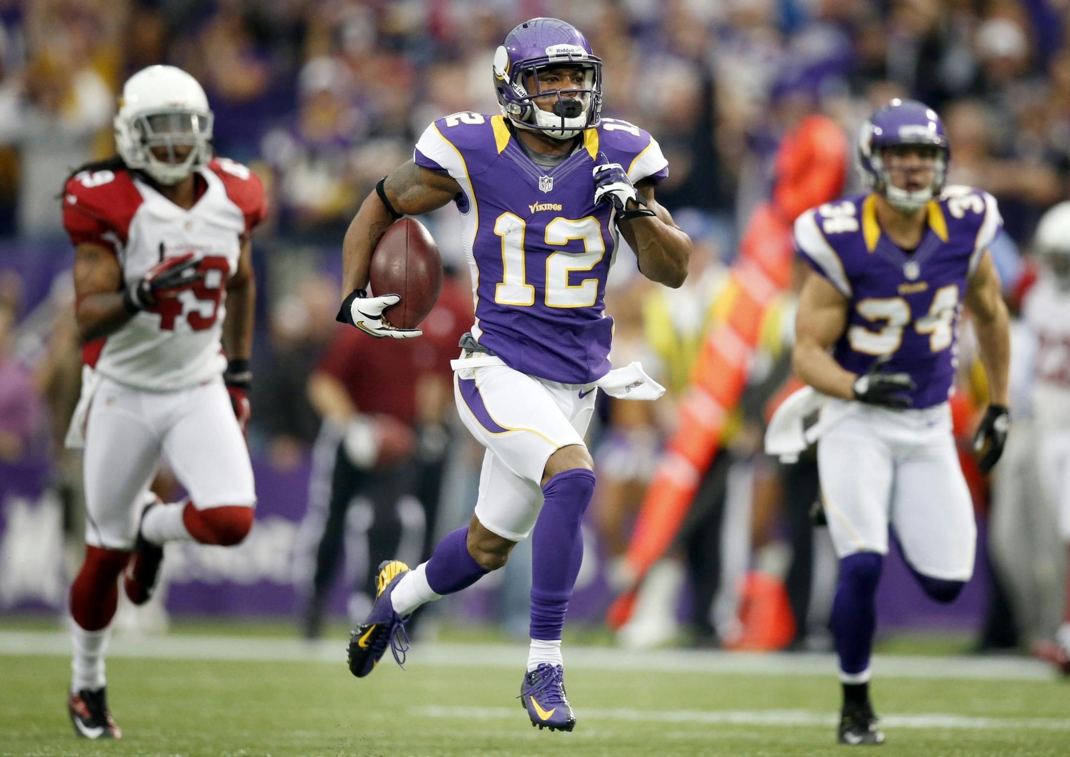 Minnesota Vikings Percy Harvin (12) ran back the opening kickoff for what appeared to be a touchdown against Arizona but the play was called back on a penalty.