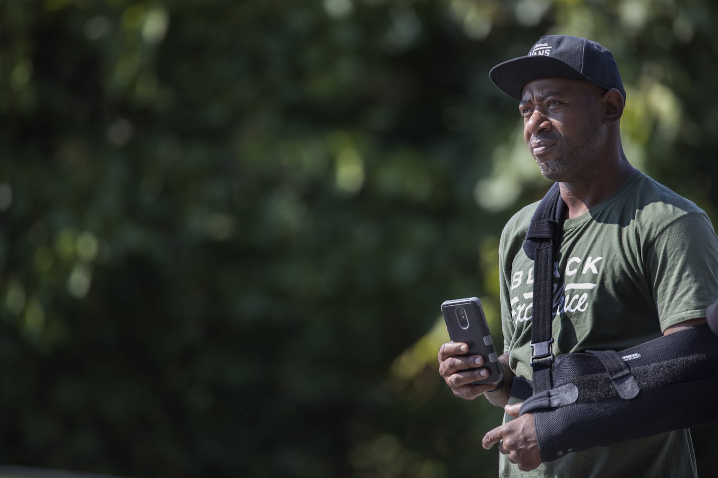 John Thompson looked on as the BCA processed the scene were a person was killed by St. Paul Police in the 900 block of St. Anthony Avenue Sunday August 5, 2018 in St. Paul, MN. ] JERRY HOLT &#xef; jerry.holt@startribune.com