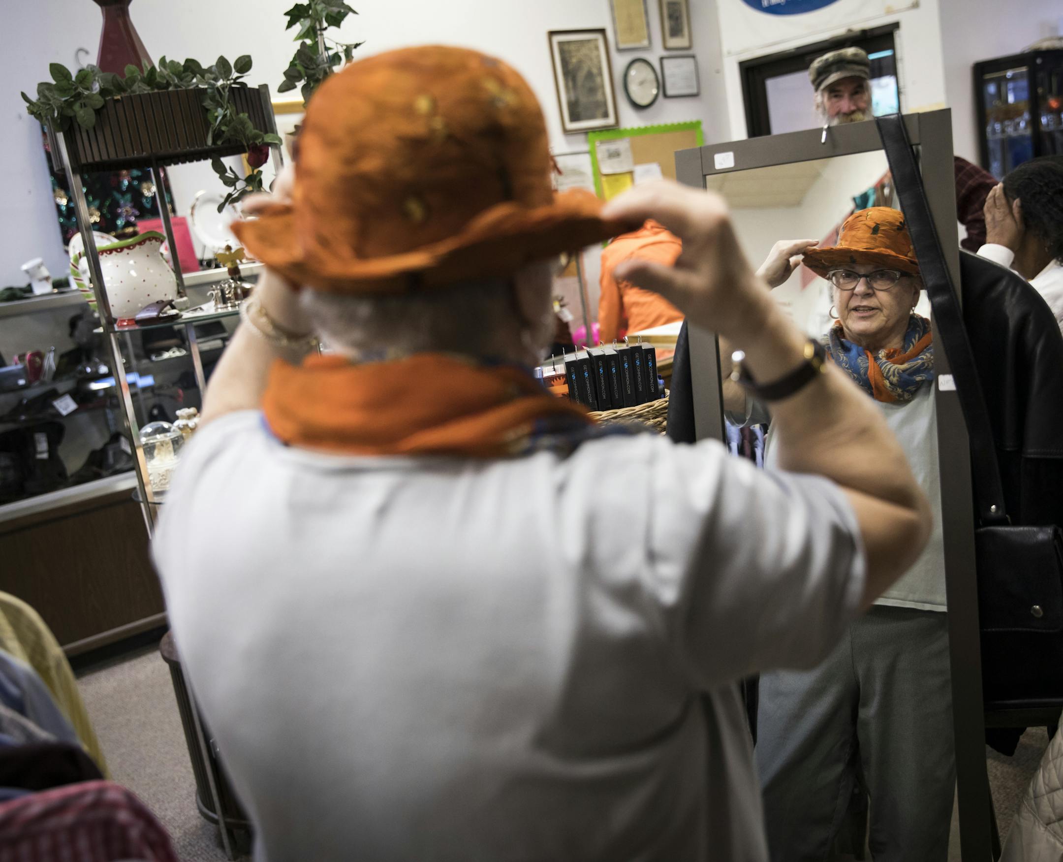 Mari Griffin shopped for hats at Steeple People thrift store on Thursday, December 1, 2016, in MInneapolis, Minn. Steeple People is planing to close for good on January 31. ] RENEE JONES SCHNEIDER • renee.jones@startribune.com