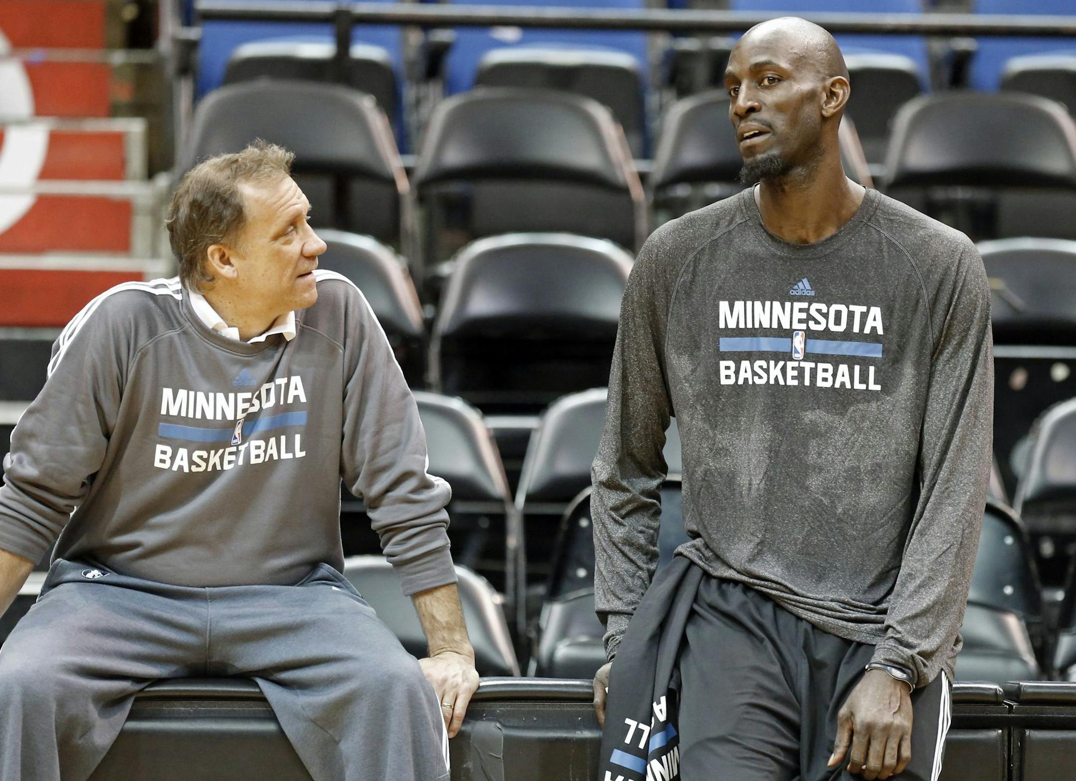 Minnesota Timberwolves' Kevin Garnett, right, talks with head coach Flip Saunders after his first practice on his return to his former team that originally drafted him out of high school, Tuesday, Feb. 24, 2015, in Minneapolis. Garnett waived his no-trade clause with the Brooklyn Nets to return to Minnesota. (AP Photo/Jim Mone) ORG XMIT: MIN2015022415311853