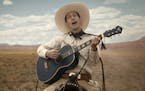 This image released by Netflix shows Tim Blake Nelson as Buster Scruggs in a scene from "The Ballad of Buster Scruggs," a film by Joel and Ethan Coen 