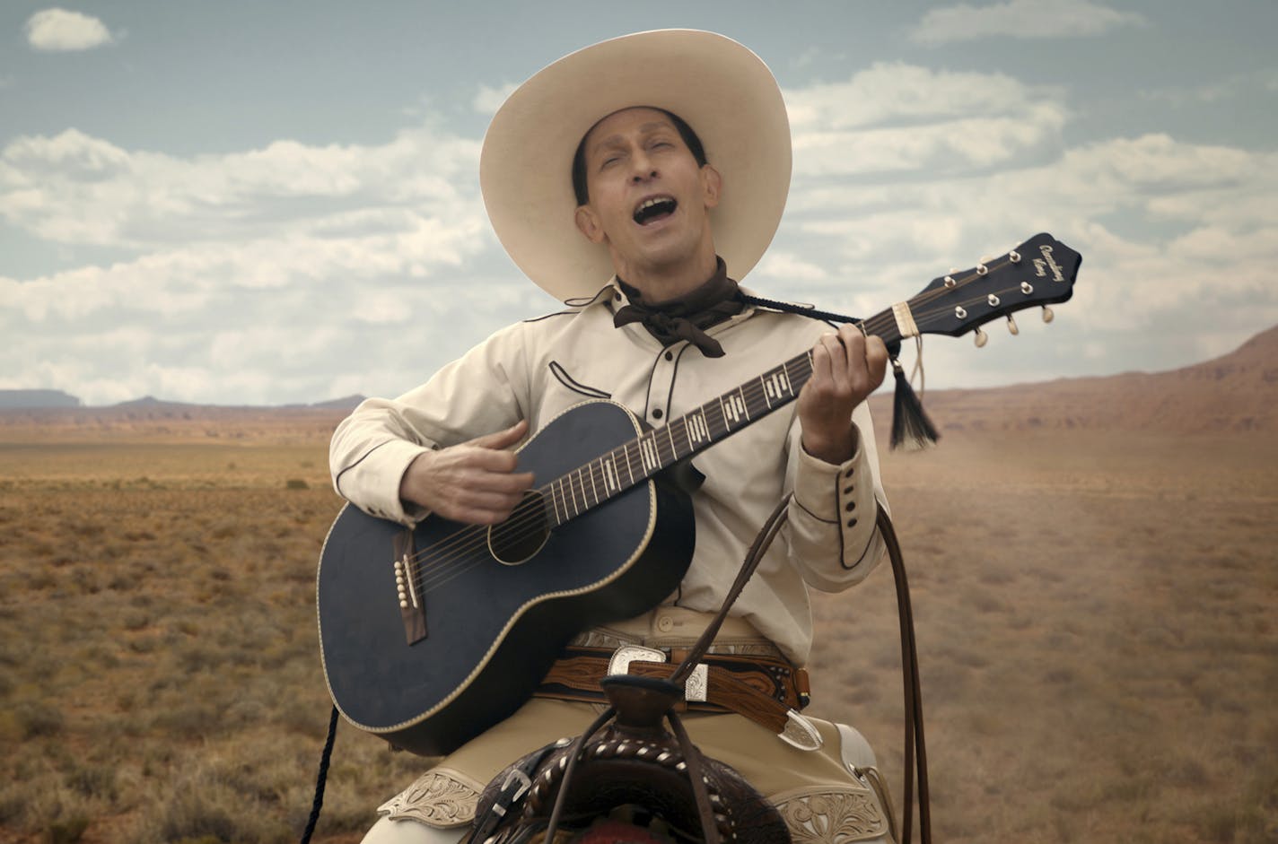 This image released by Netflix shows Tim Blake Nelson as Buster Scruggs in a scene from "The Ballad of Buster Scruggs," a film by Joel and Ethan Coen which will have an exclusive run in theaters before becoming available on Netflix's streaming service. (Netflix via AP)