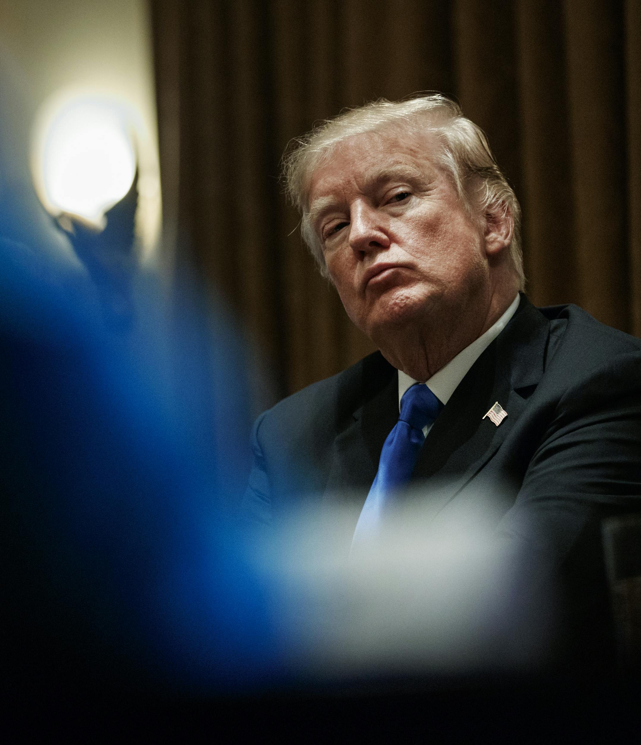 President Donald Trump pauses during a meeting in the Cabinet Room of the White House, in Washington, Wednesday, Feb. 28, 2018, with members of congress to discuss school and community safety. (AP Photo/Carolyn Kaster)