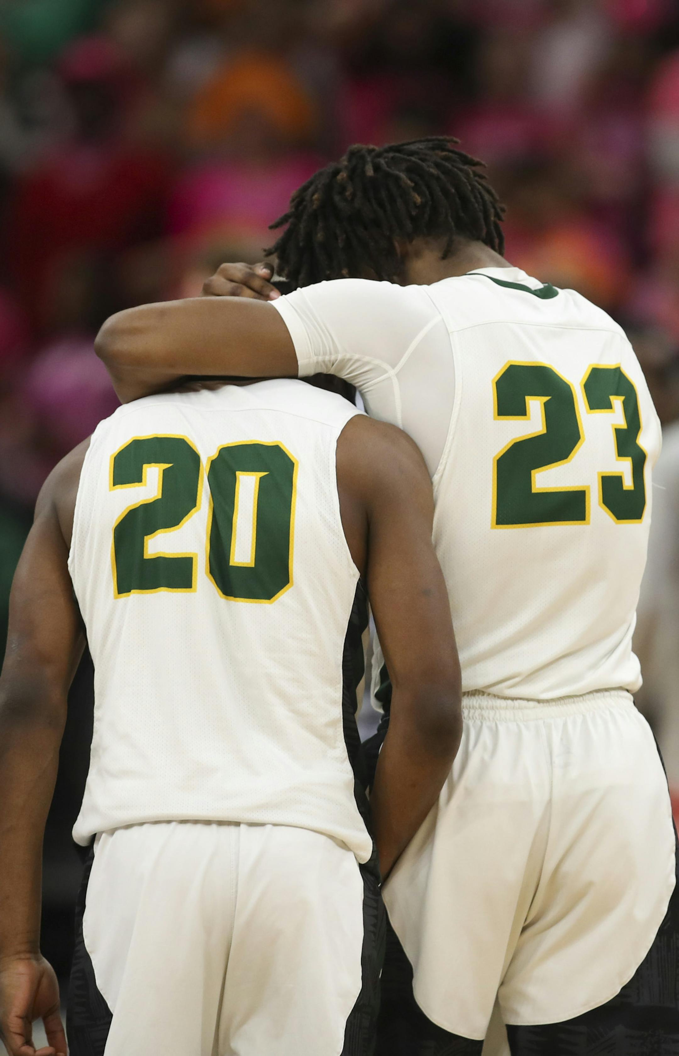 Park Center's Detavius Frierson (23) consoled his teammate Emmanuel Tamba (20) after their two point loss to Lakeville North. ] JEFF WHEELER • jeff.wheeler@startribune.com Lakeville North upset Park Center 47-45 in a semifinal game of the Class 4A boys' basketball tournament Thursday night, March 21, 2019 at Target Center in Minneapolis.