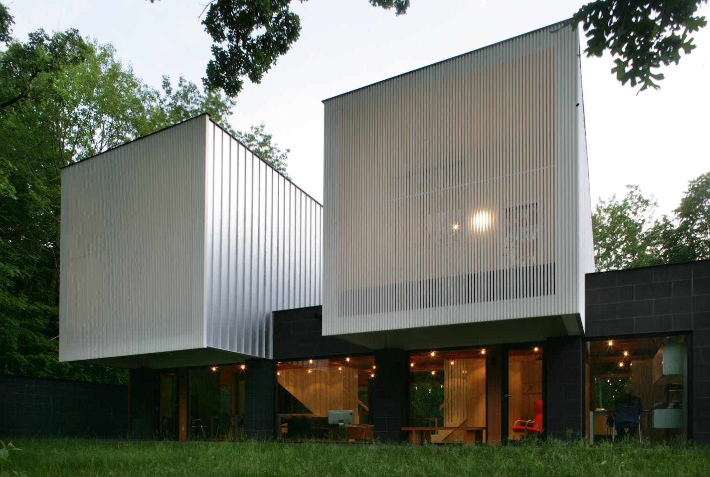 Kevin Streeter's very modern, AIA award-winning house in Deephaven features a unique design: shared common spaces topped by two separate bedroom cubes, one for him, one for his young-adult son. The home was designed by architect David Salmela.