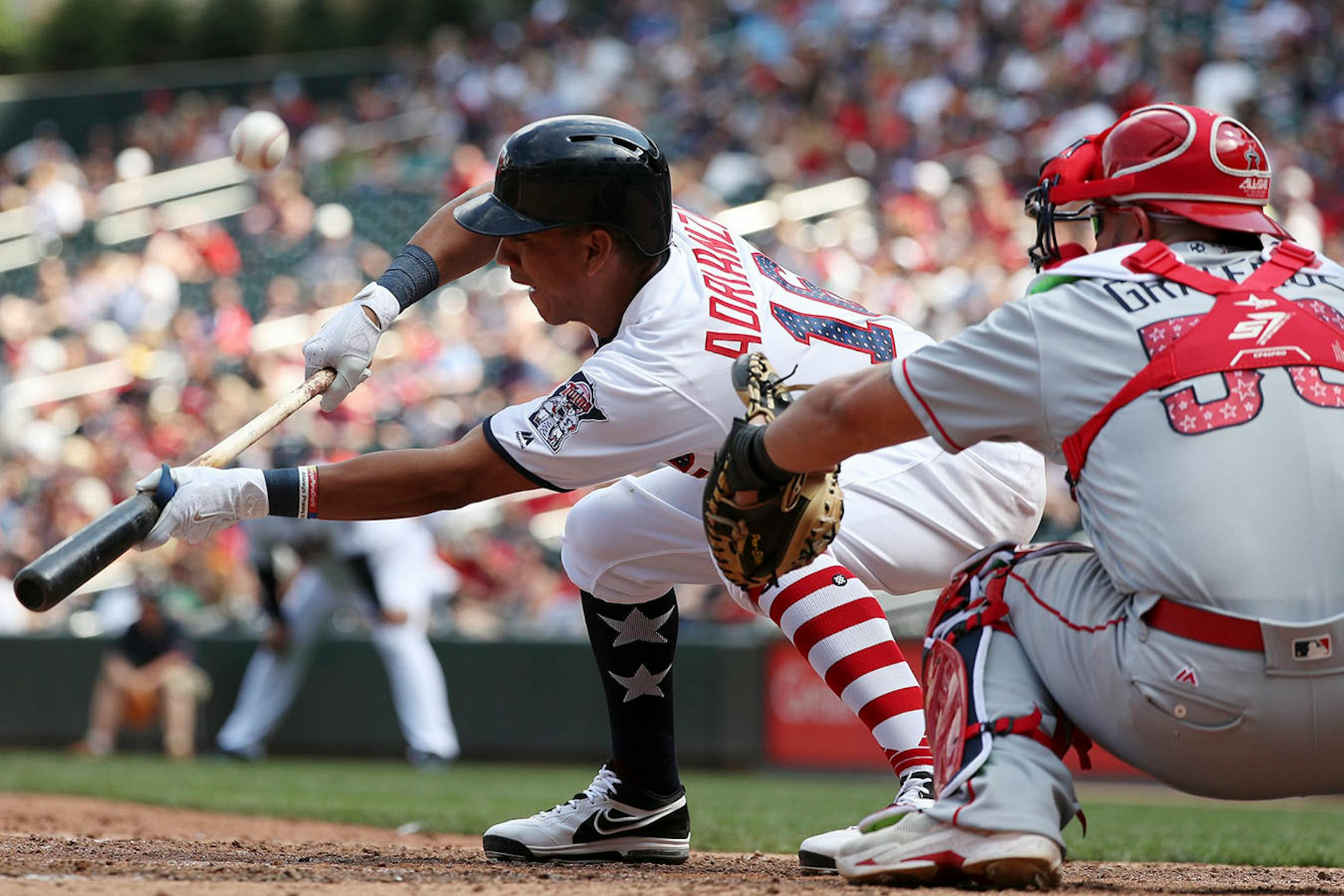 Minnesota Twins shortstop Ehire Adrianza (16) bunted in the sixth inning.