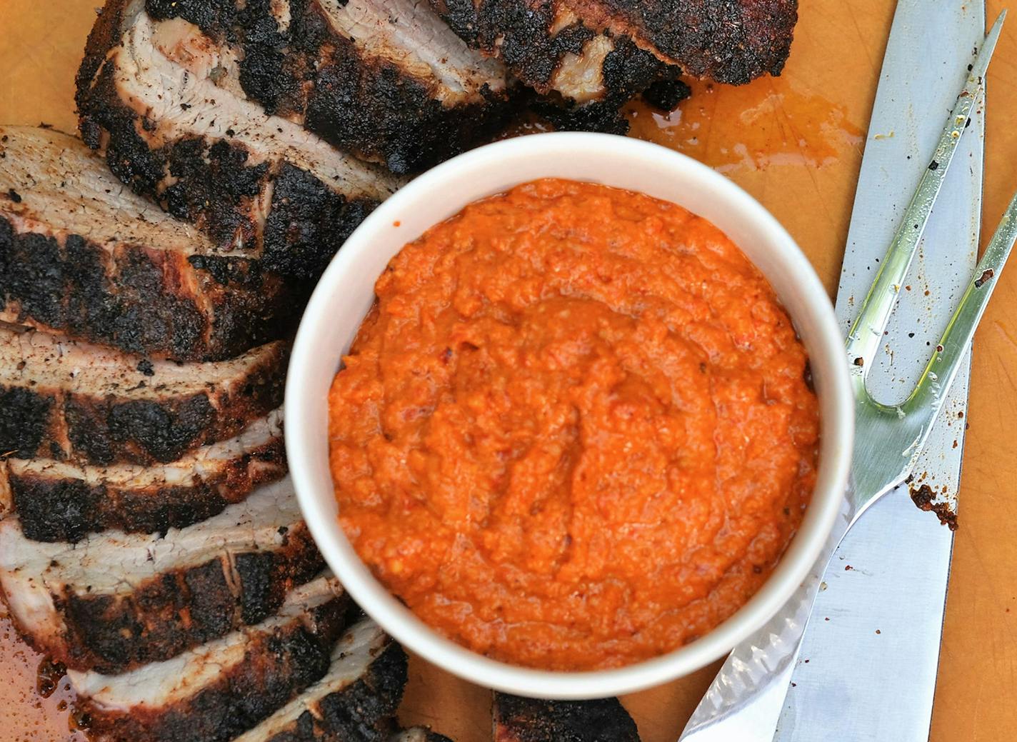 Grilled pork tenderloin with Romesco sauce.