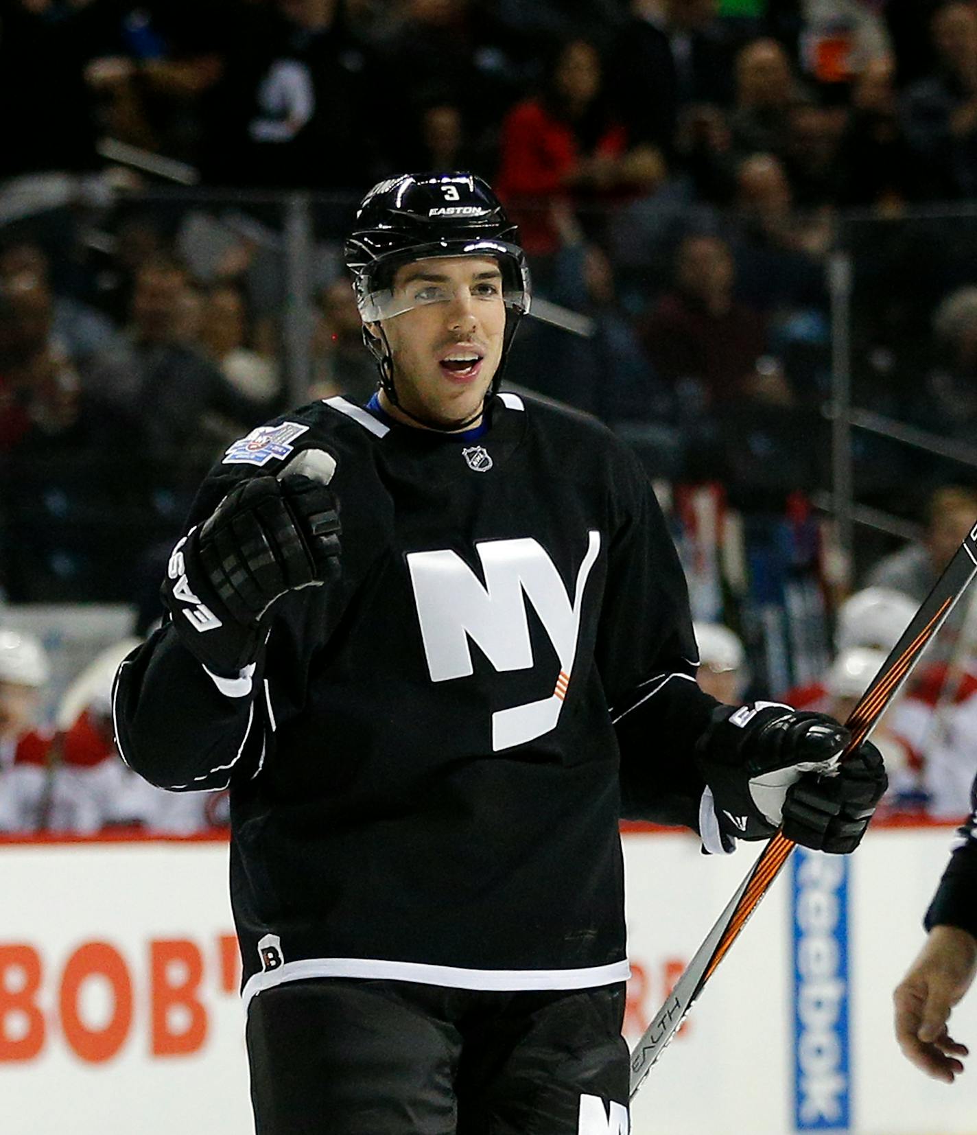 New York Islanders defenseman Travis Hamonic celebrates his goal during the second period of an NHL hockey game against the Montreal Canadiens on Friday, Nov. 20, 2015, in New York (AP Photo/Paul Bereswill)